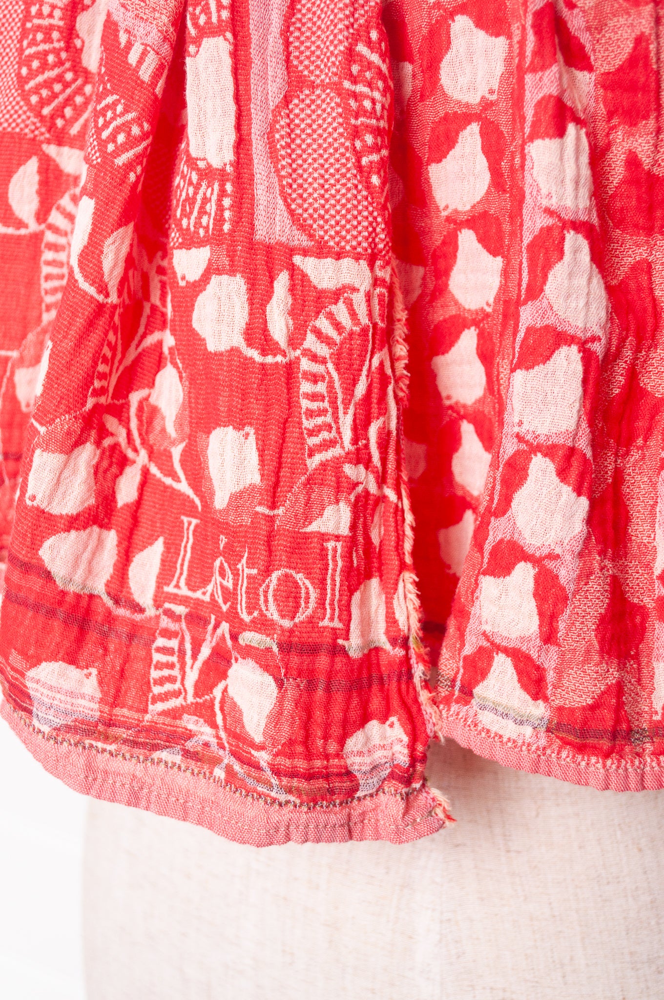Letol organic cotton jacquard weave scarf Lino flowers and geometrics in cerise cherry red.