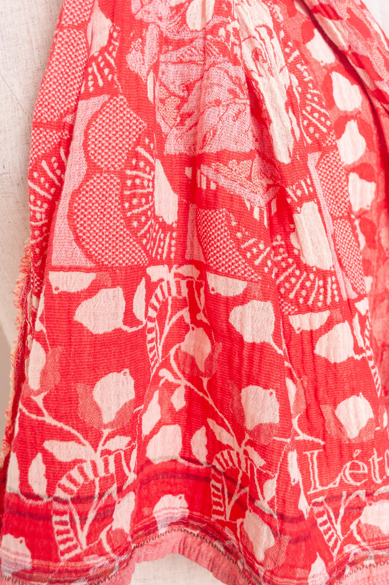 Letol organic cotton jacquard weave scarf Lino flowers and geometrics in cerise cherry red.