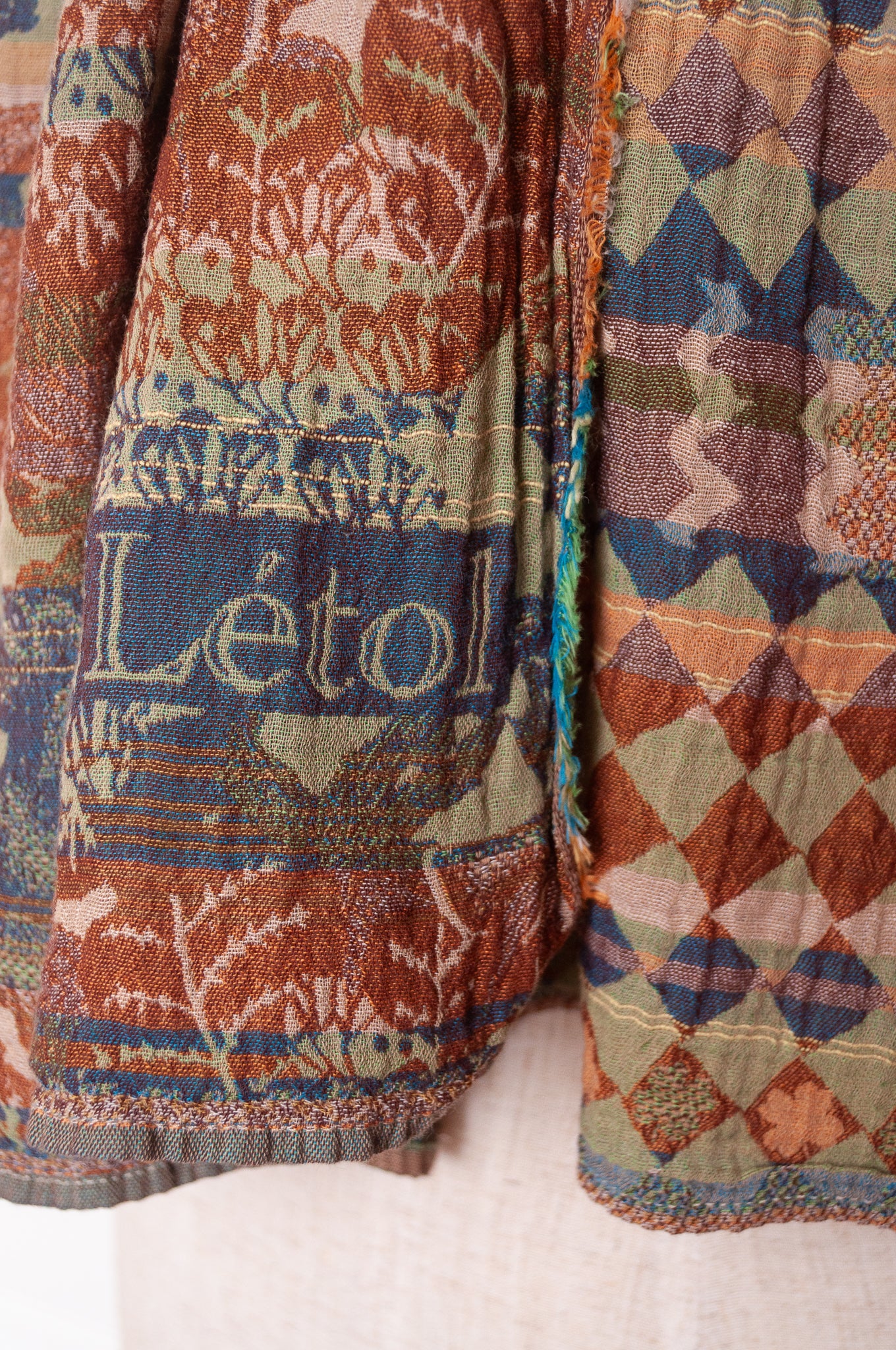 Letol organic cotton jacquard weave scarf Felicien Indian inspired with checks foliage and elephants in pickle green, brown and teal.