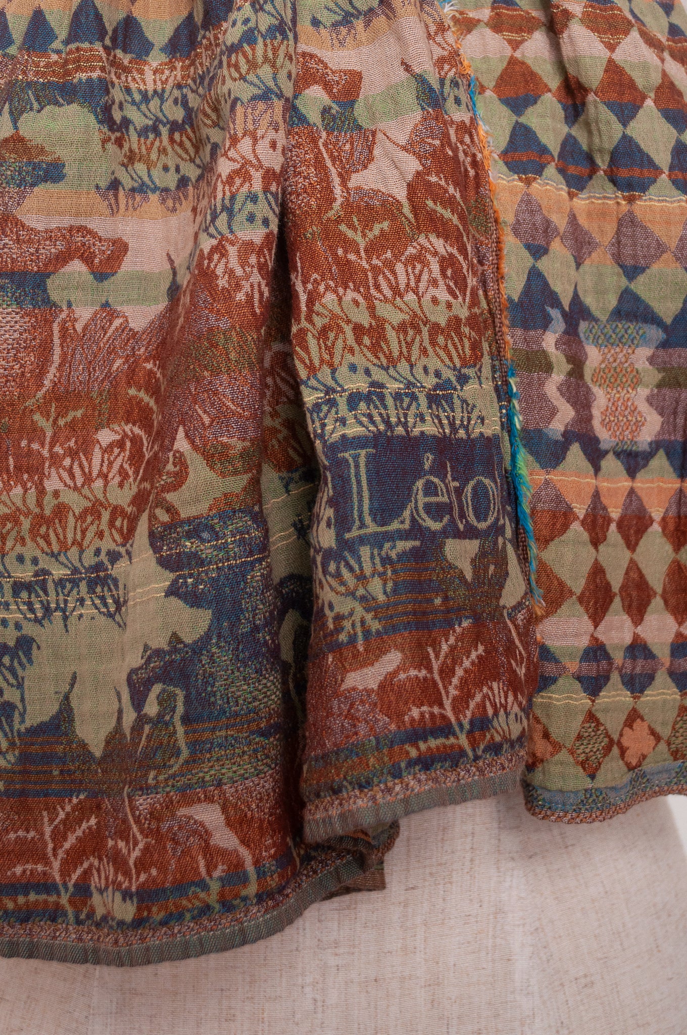 Letol organic cotton jacquard weave scarf Felicien Indian inspired with checks foliage and elephants in pickle green, brown and teal.