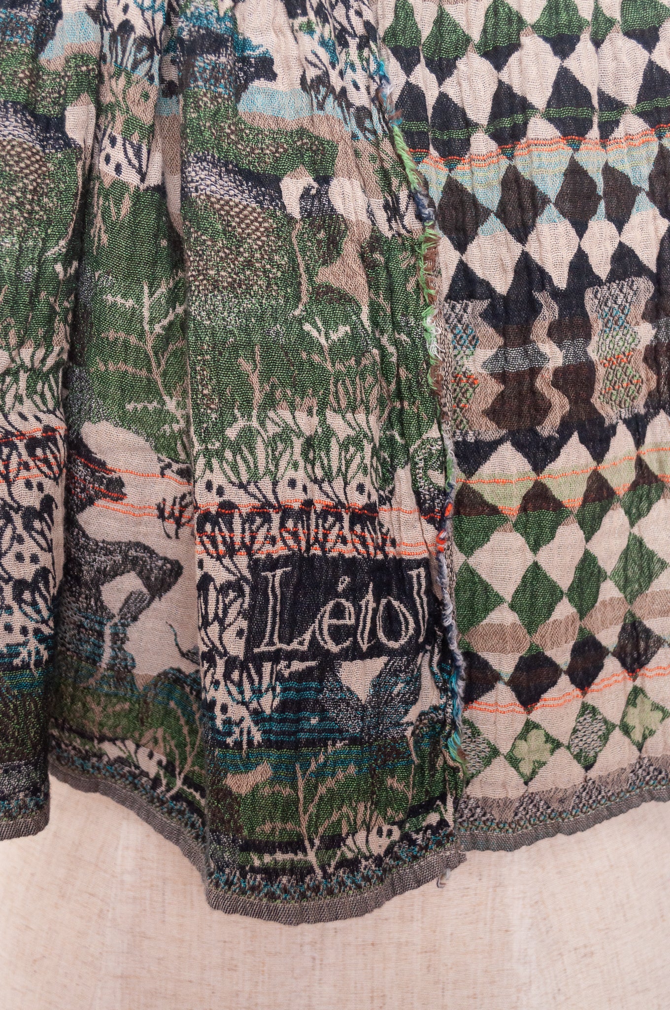 Letol organic cotton jacquard weave scarf in Felicien Indian design with elephants and check in black and green nuit jade.