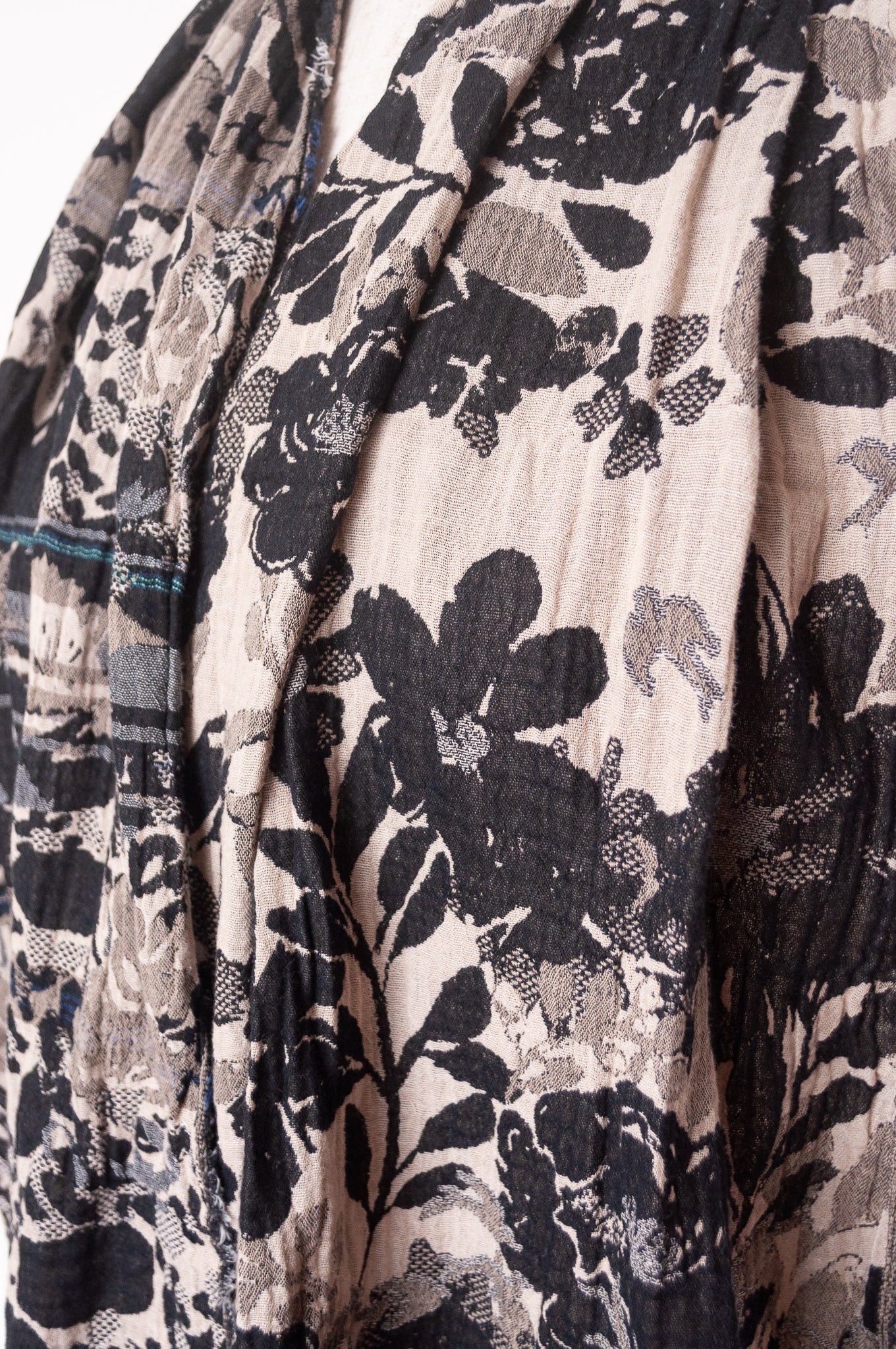 Letol organic cotton floral jacquard scarf Emilienne floral design in black, with highlights of blue.