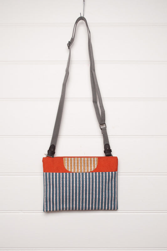 Anna Kaszer cotton canvas Rola mini crossbody bag in aqua and orange.