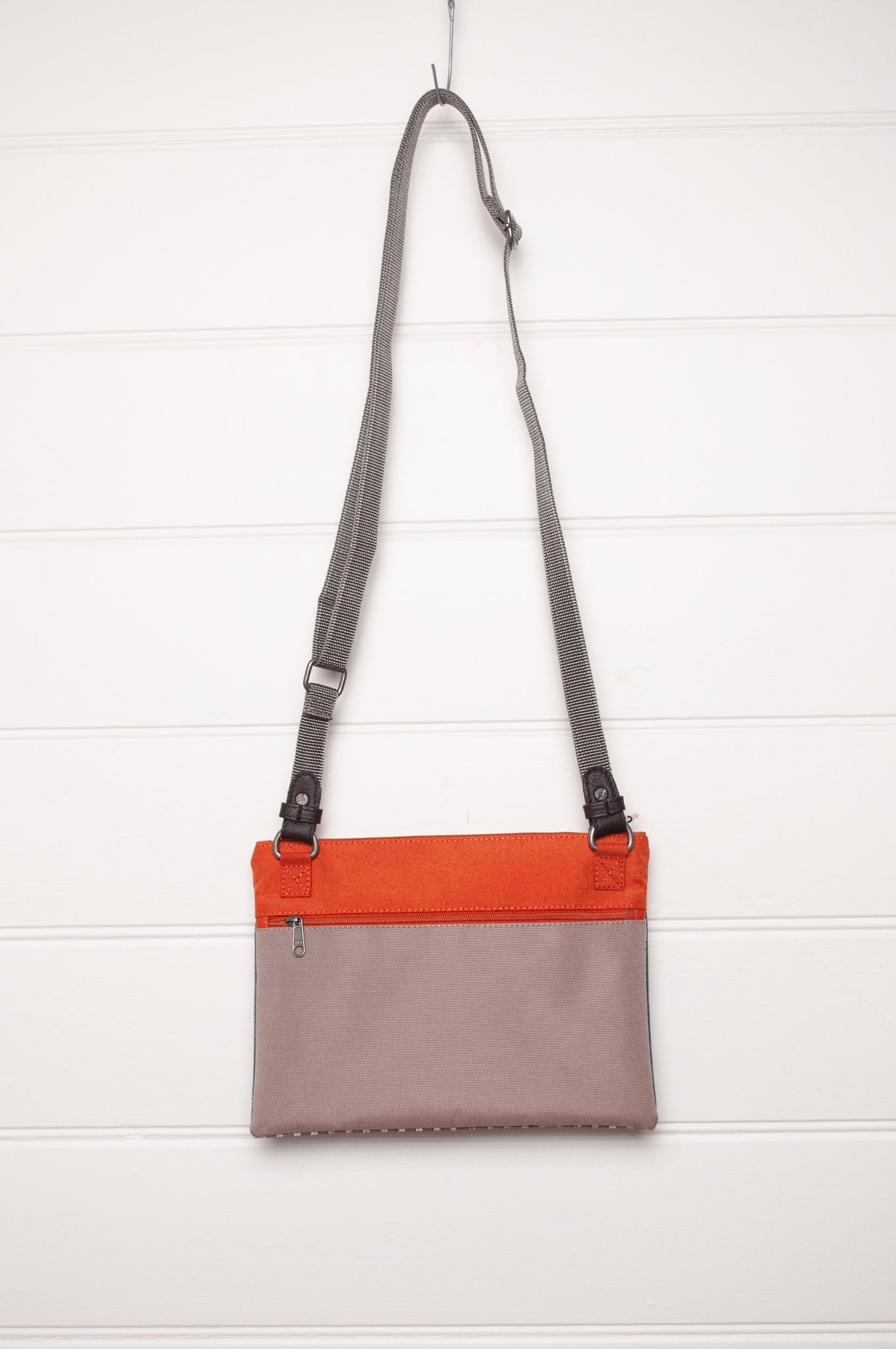 Anna Kaszer cotton canvas Rola mini crossbody bag in aqua and orange.