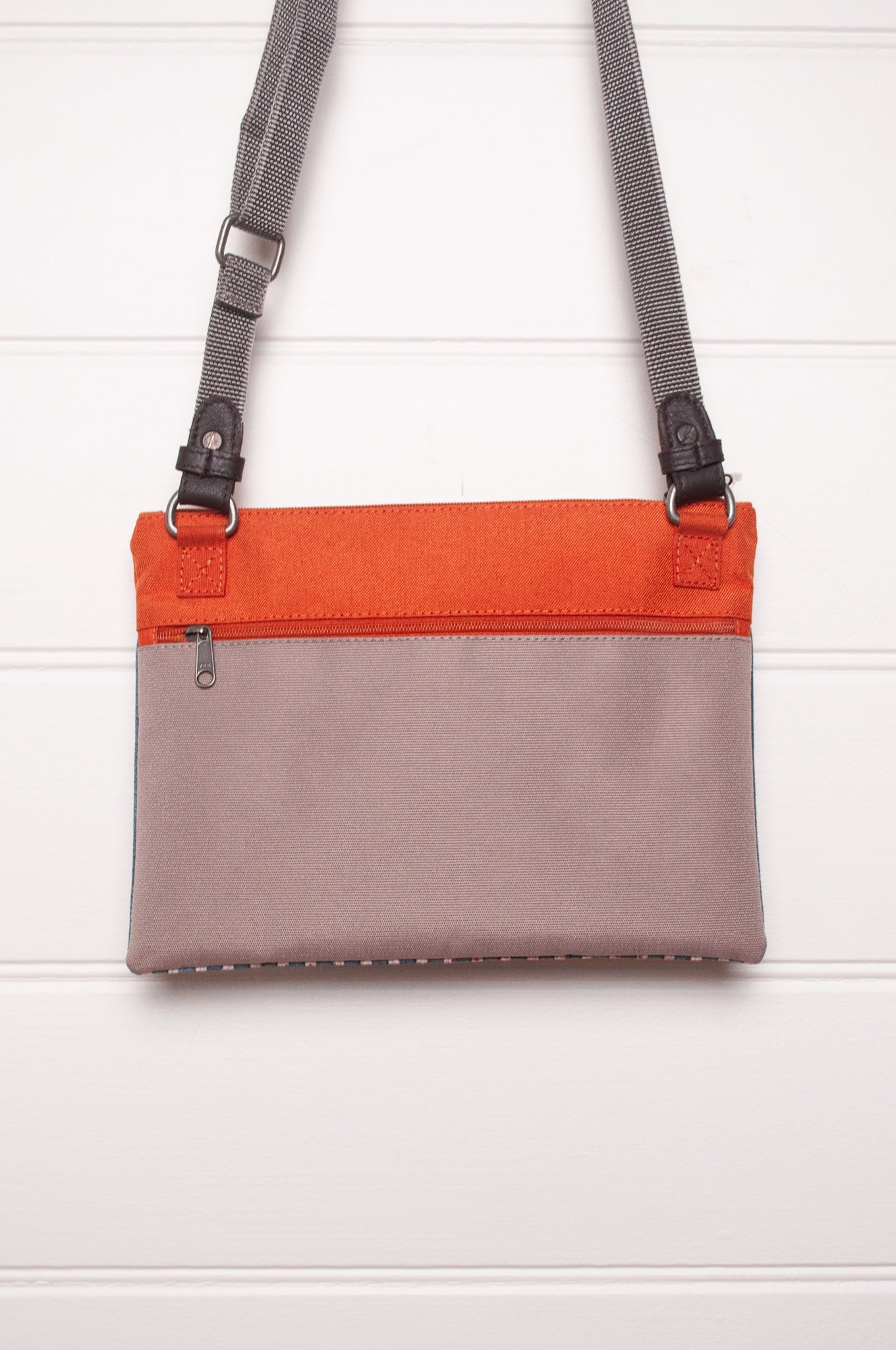 Anna Kaszer cotton canvas Rola mini crossbody bag in aqua and orange.
