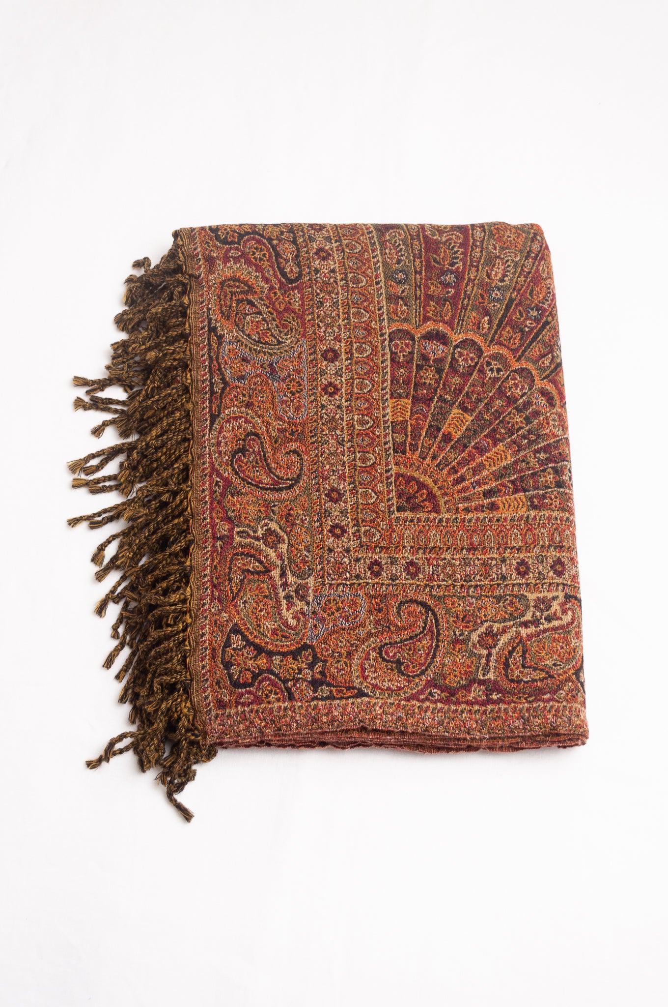 Tasseled wool throw - rust paisley