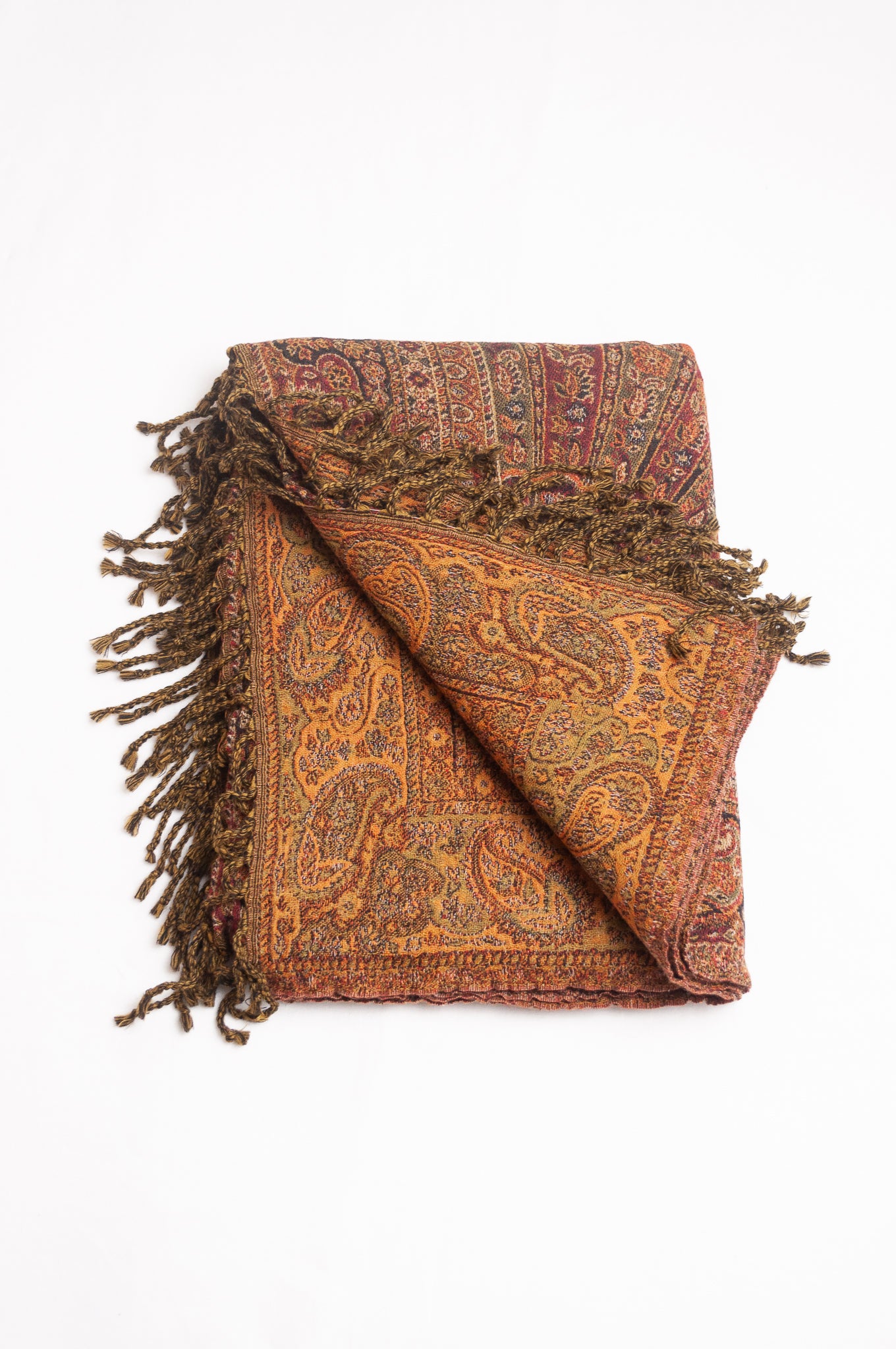 Tasseled wool throw - rust paisley