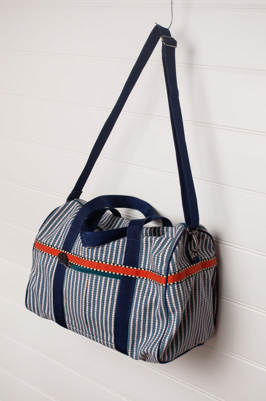 Anna Kaszer Helzip cotton canvas weekend duffle bag in blue stripe.