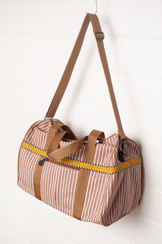 Anna Kaszer Helzip cotton canvas weekend duffle bag in mustard stripe.