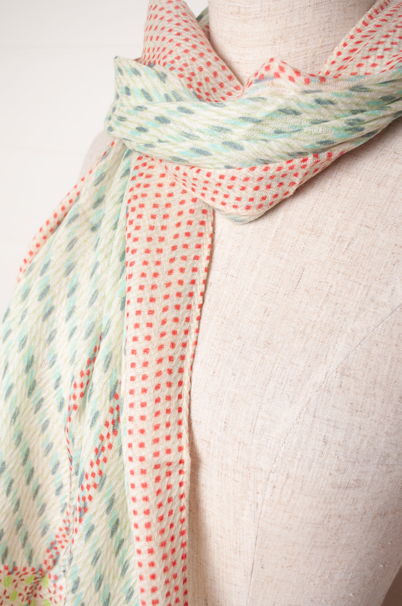 Anna Kaszer fine wool aqua and white scarf with red accents.