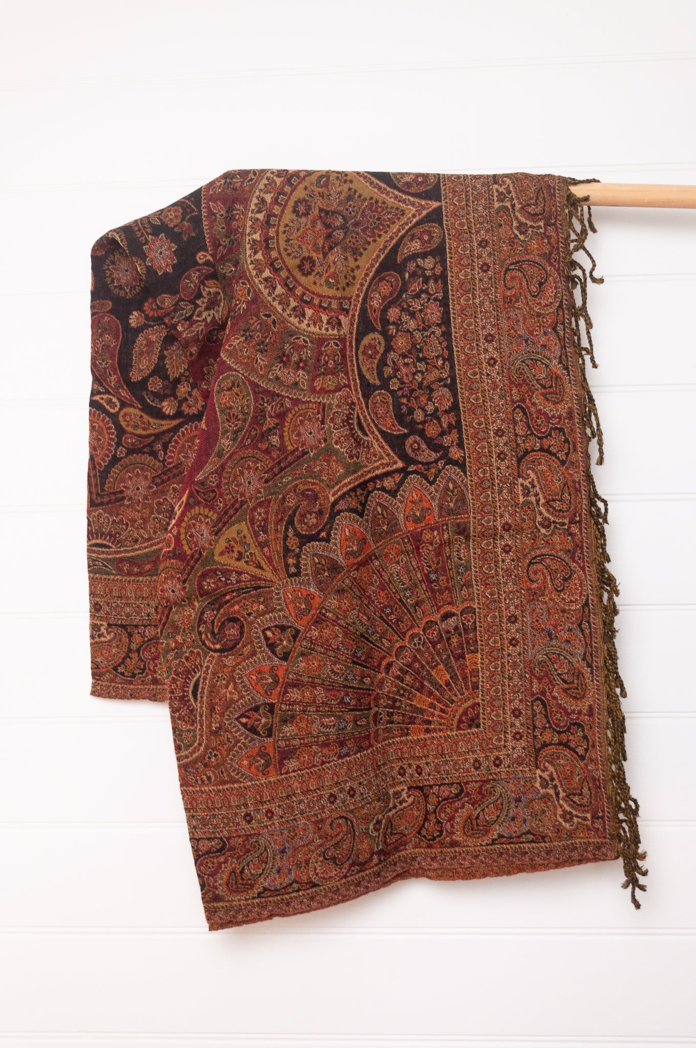 Tasseled wool throw - rust paisley