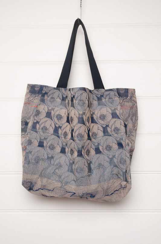 Letol organic cotton jacquard weave tote bag floral design in shades of blue.