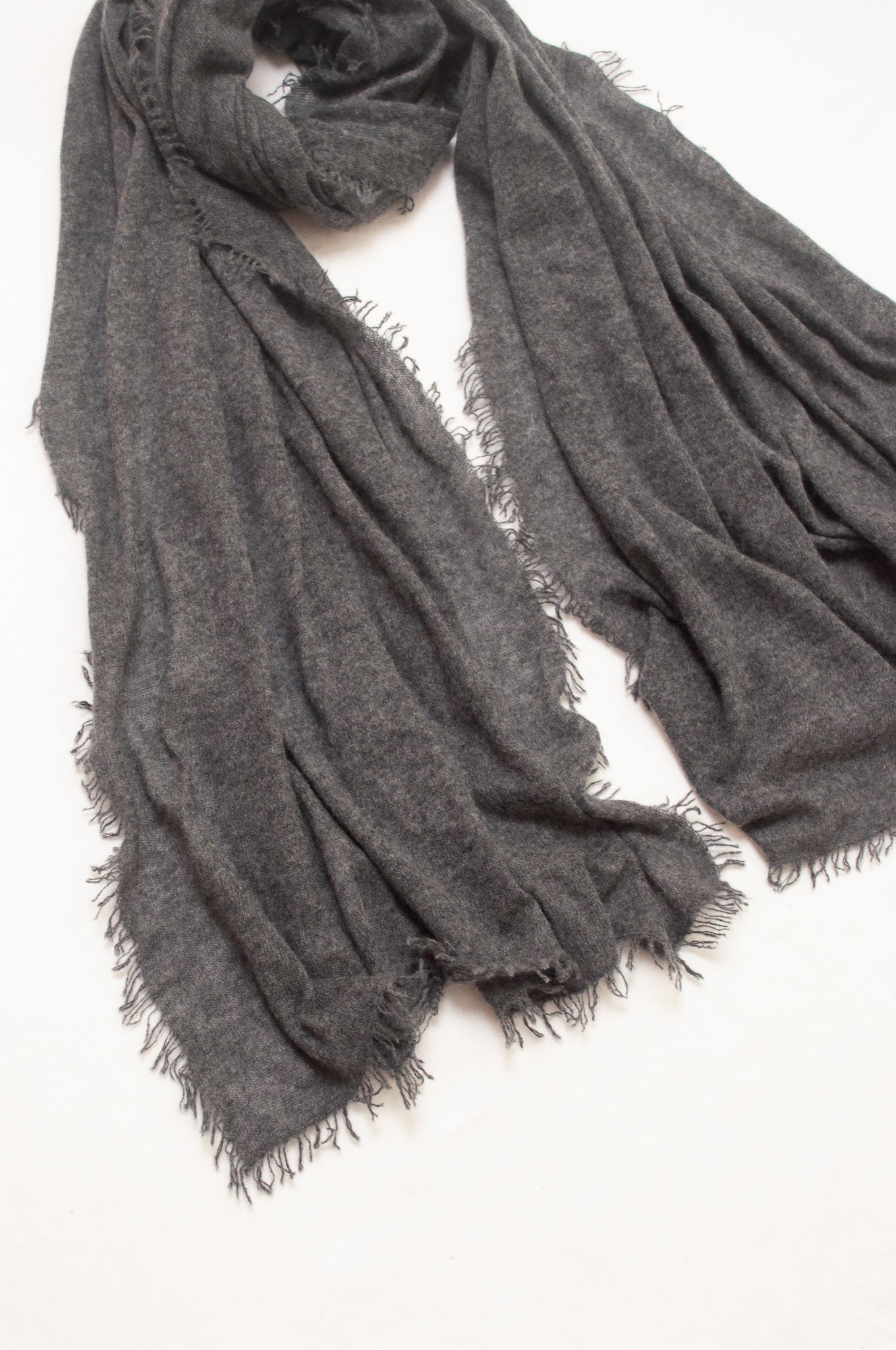 Pure cashmere, lightweight knit fringed scarf in charcoal grey.