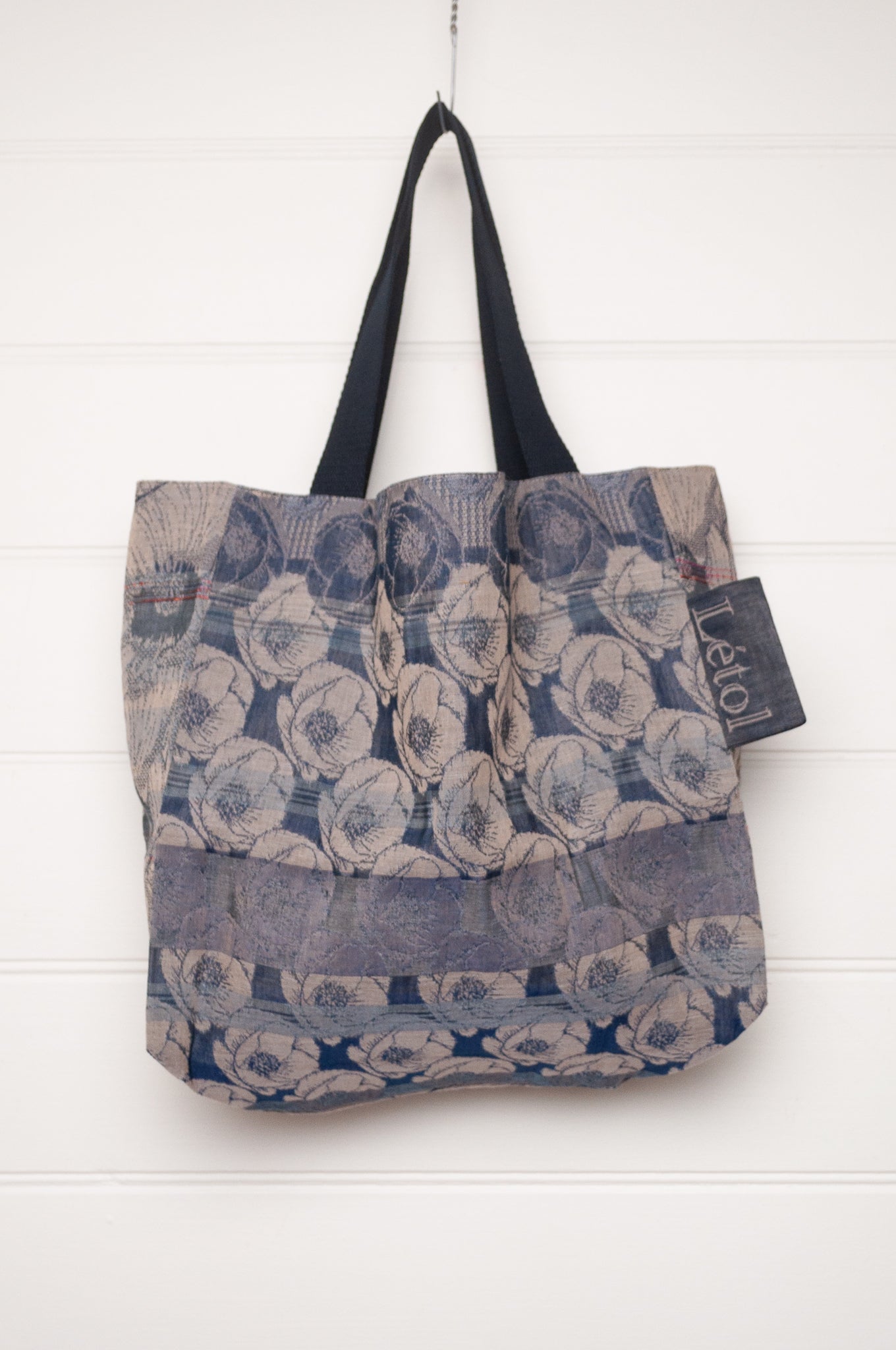 Letol organic cotton jacquard weave tote bag floral design in shades of blue.