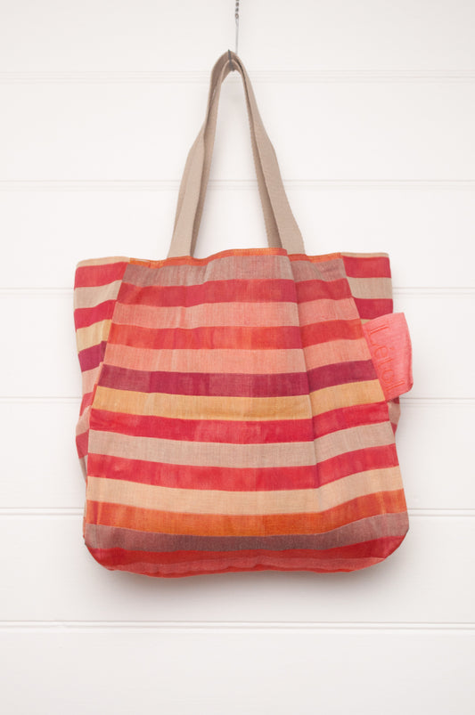 Letol organic cotton jacquard weave tote bag in stripes in pink, orange and red, and floral design.
