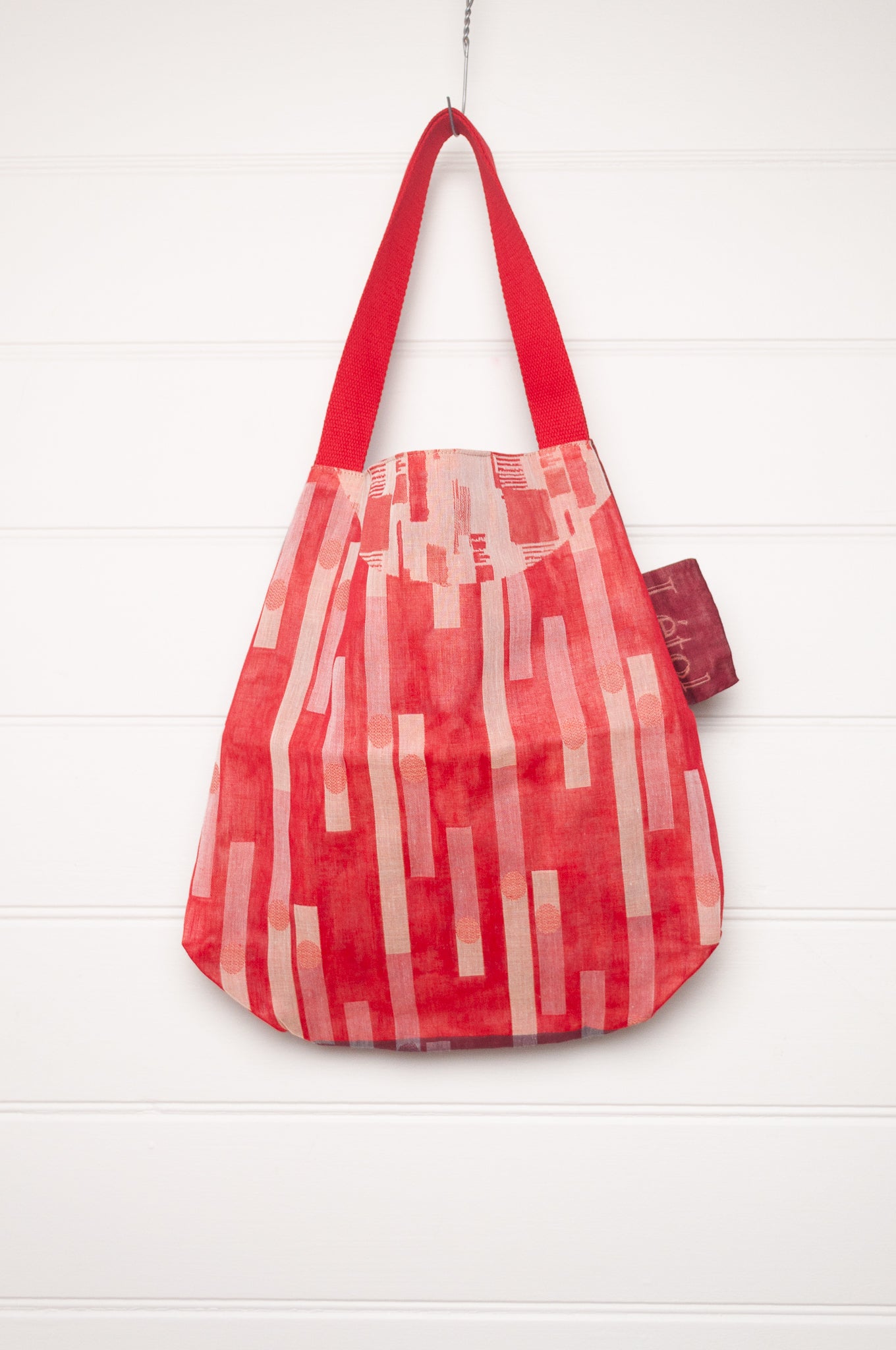 Letol organic cotton jacquard weave tote bag in foliage and stripes in red and pink.