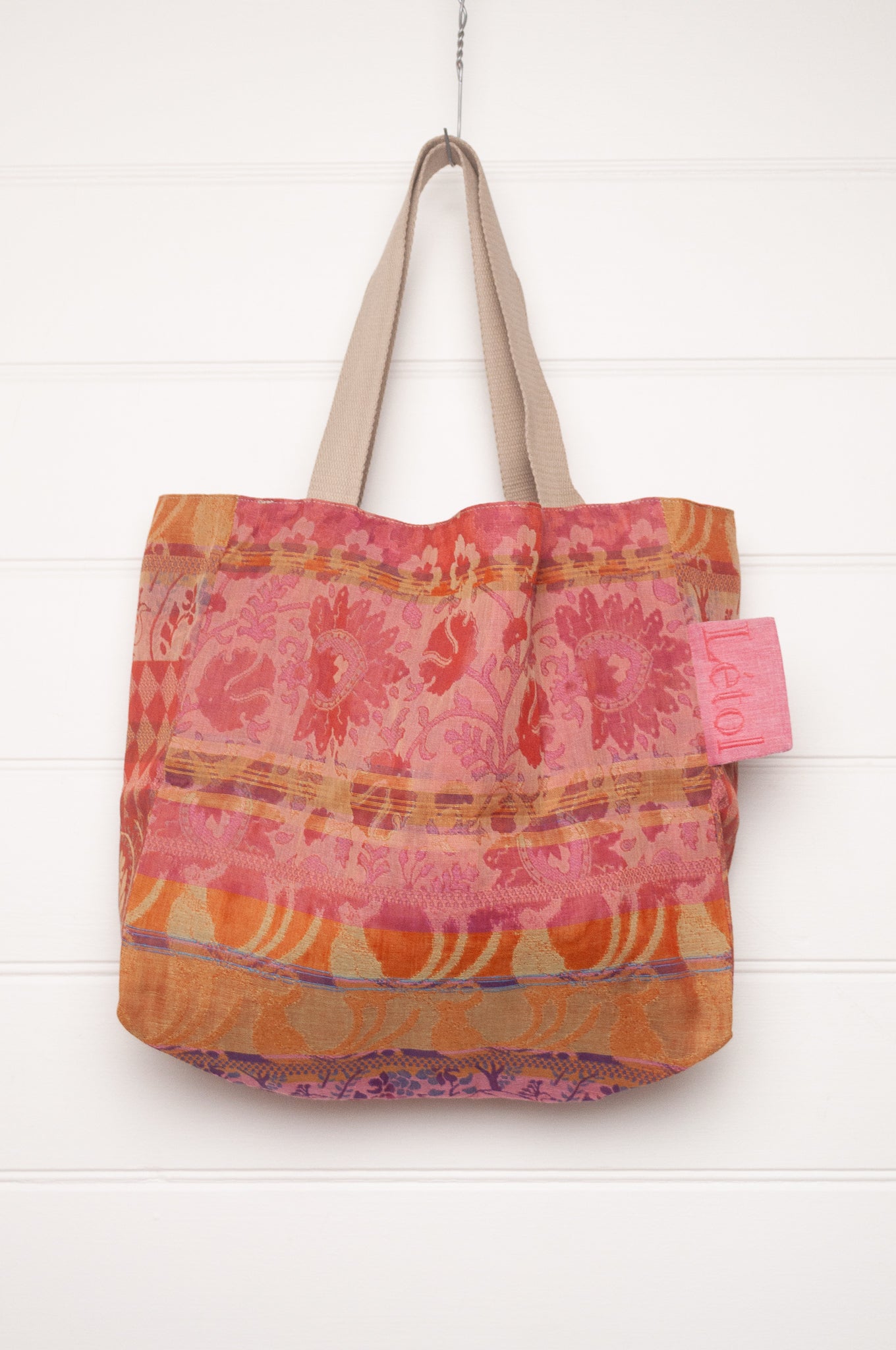 Letol organic cotton jacquard weave large tote bag in flowers in pink, orange and red.