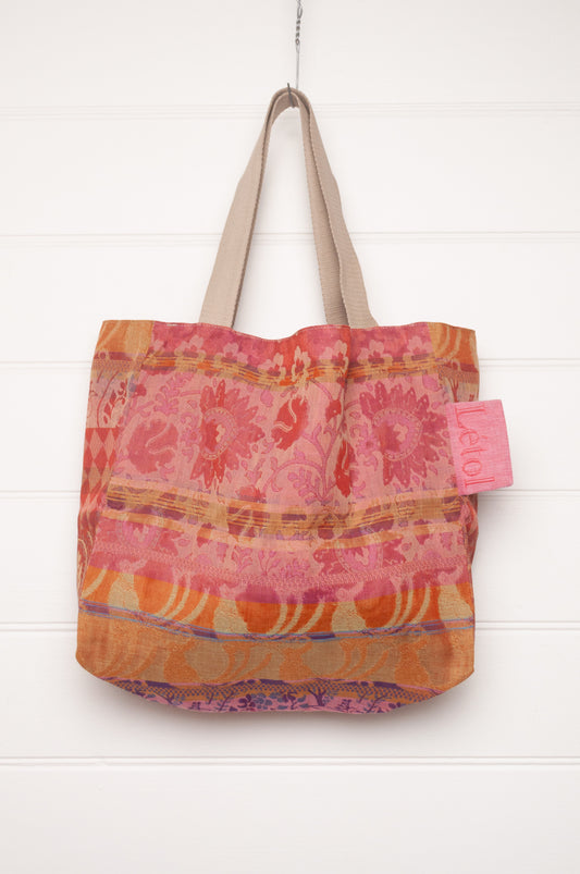 Letol organic cotton jacquard weave large tote bag in flowers in pink, orange and red.