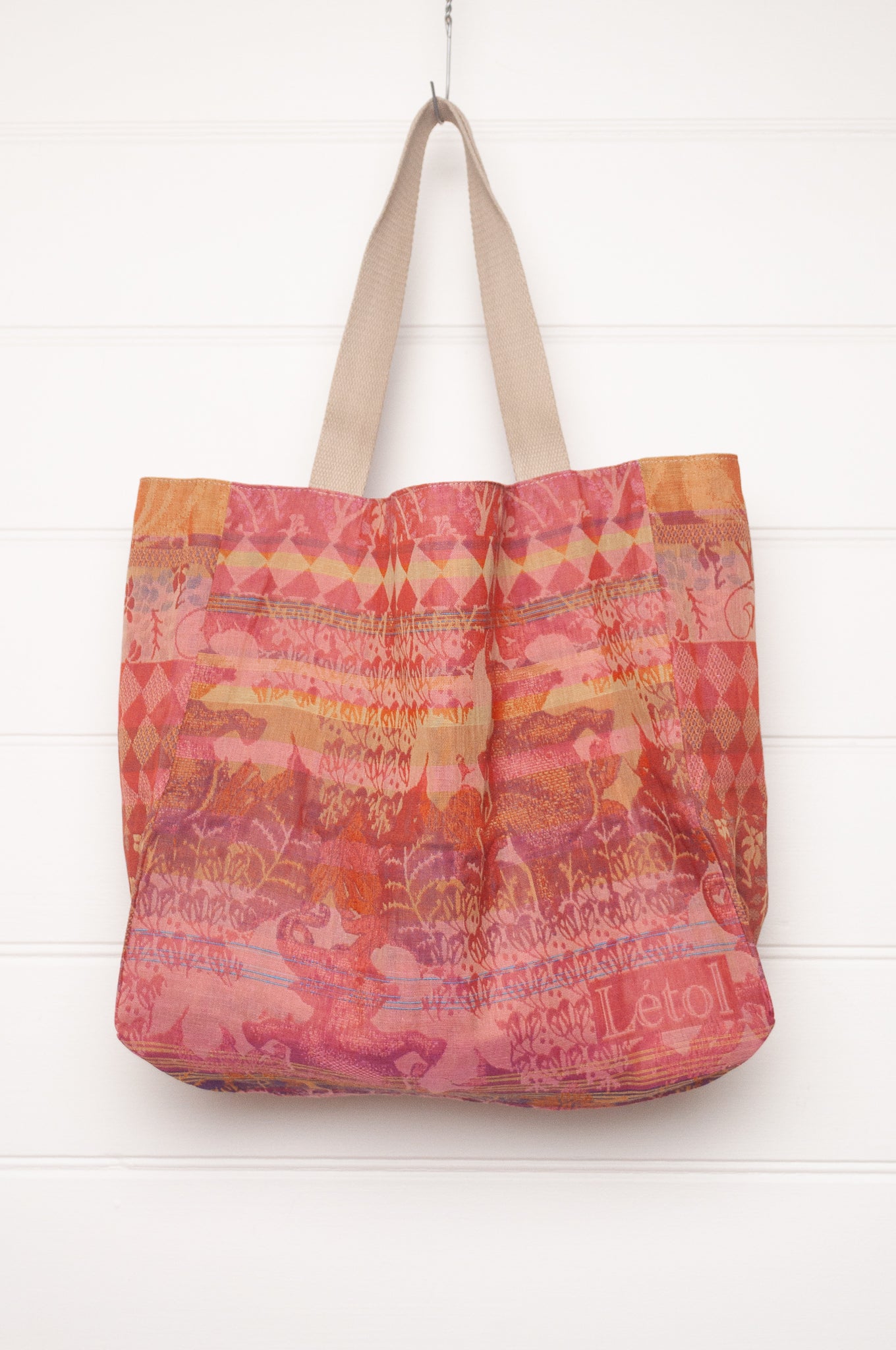 Letol organic cotton jacquard weave large tote bag in flowers in pink, orange and red.