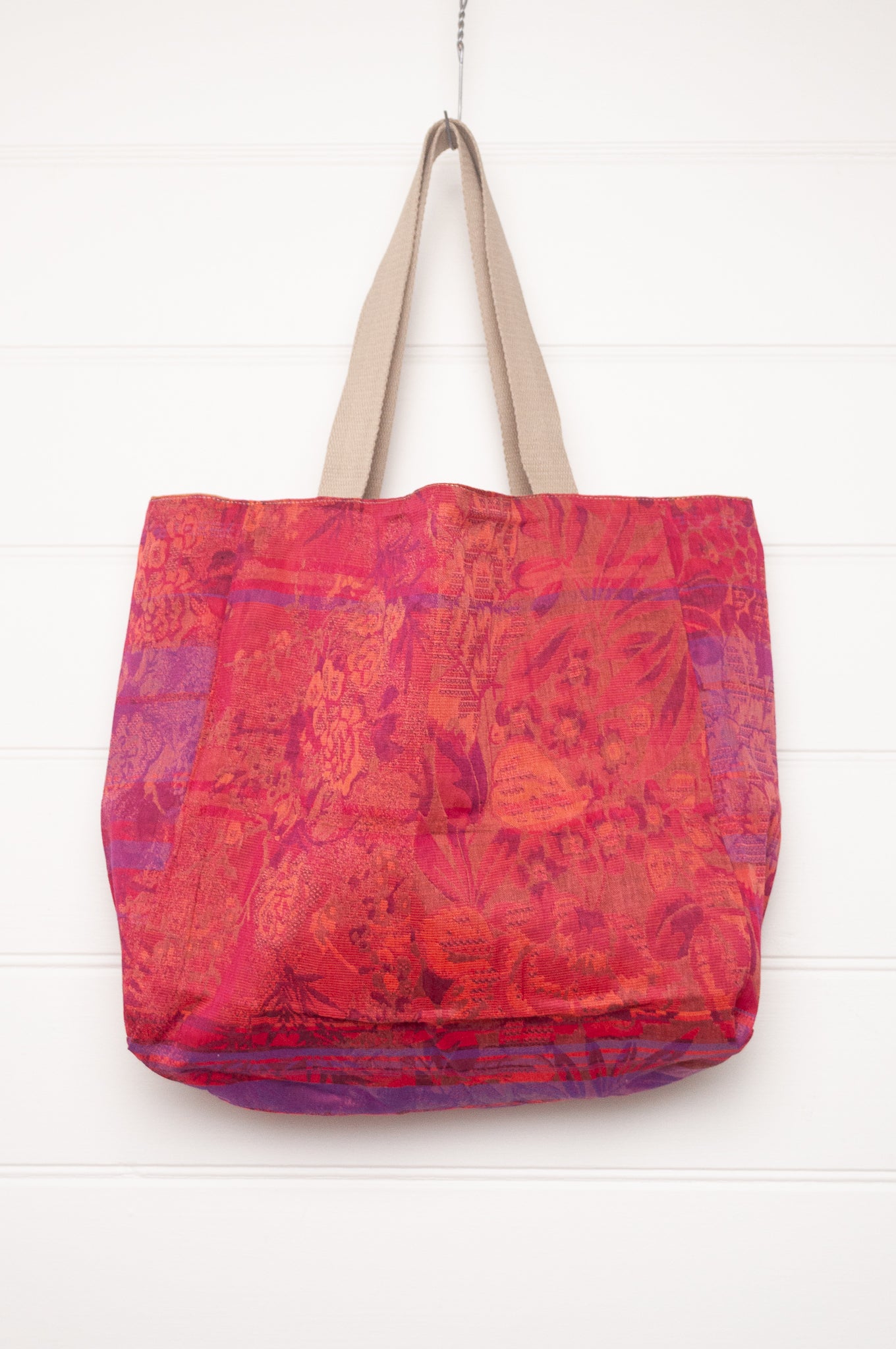 Letol organic cotton jacquard weave large tote bag in flowers in pink, orange and red.