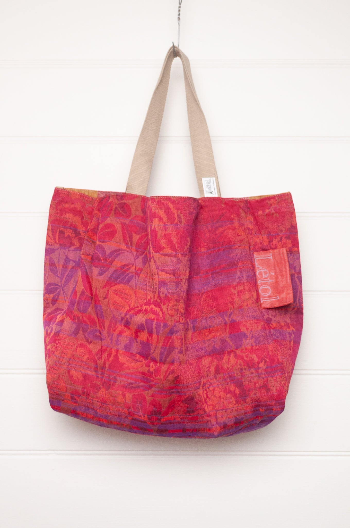 Letol organic cotton jacquard weave large tote bag in flowers in pink, orange and red.