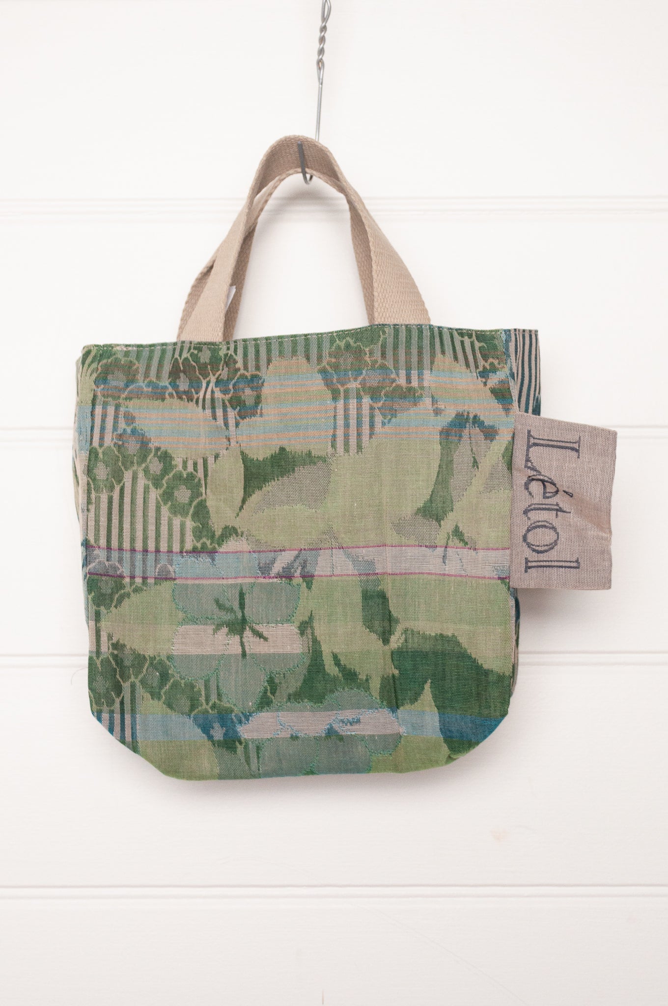 Letol organic cotton jacquard weave mini tote bag in flowers and foliage in greens and turquoise.