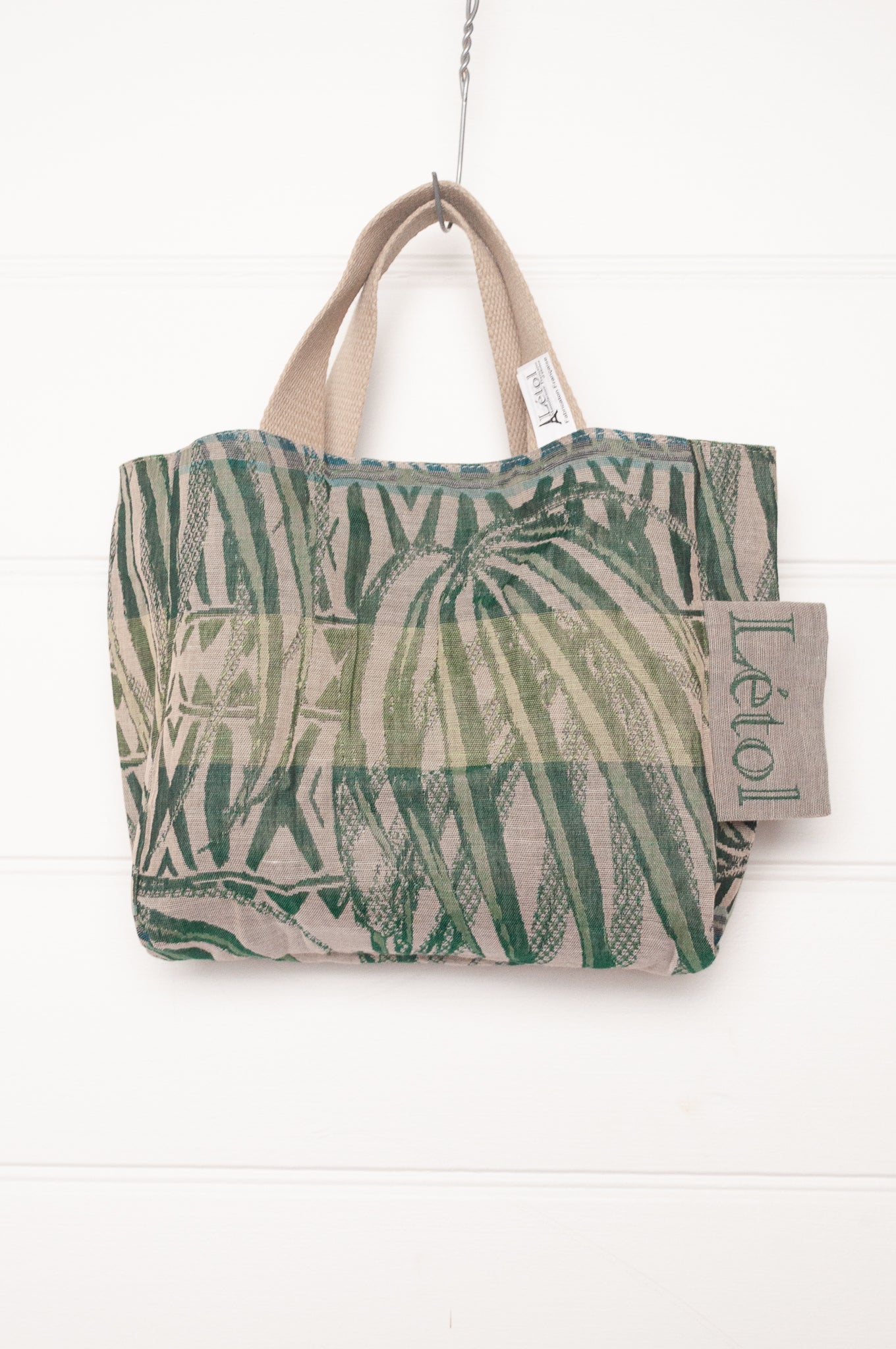 Letol organic cotton jacquard weave mini tote bag in flowers and foliage in greens and turquoise.
