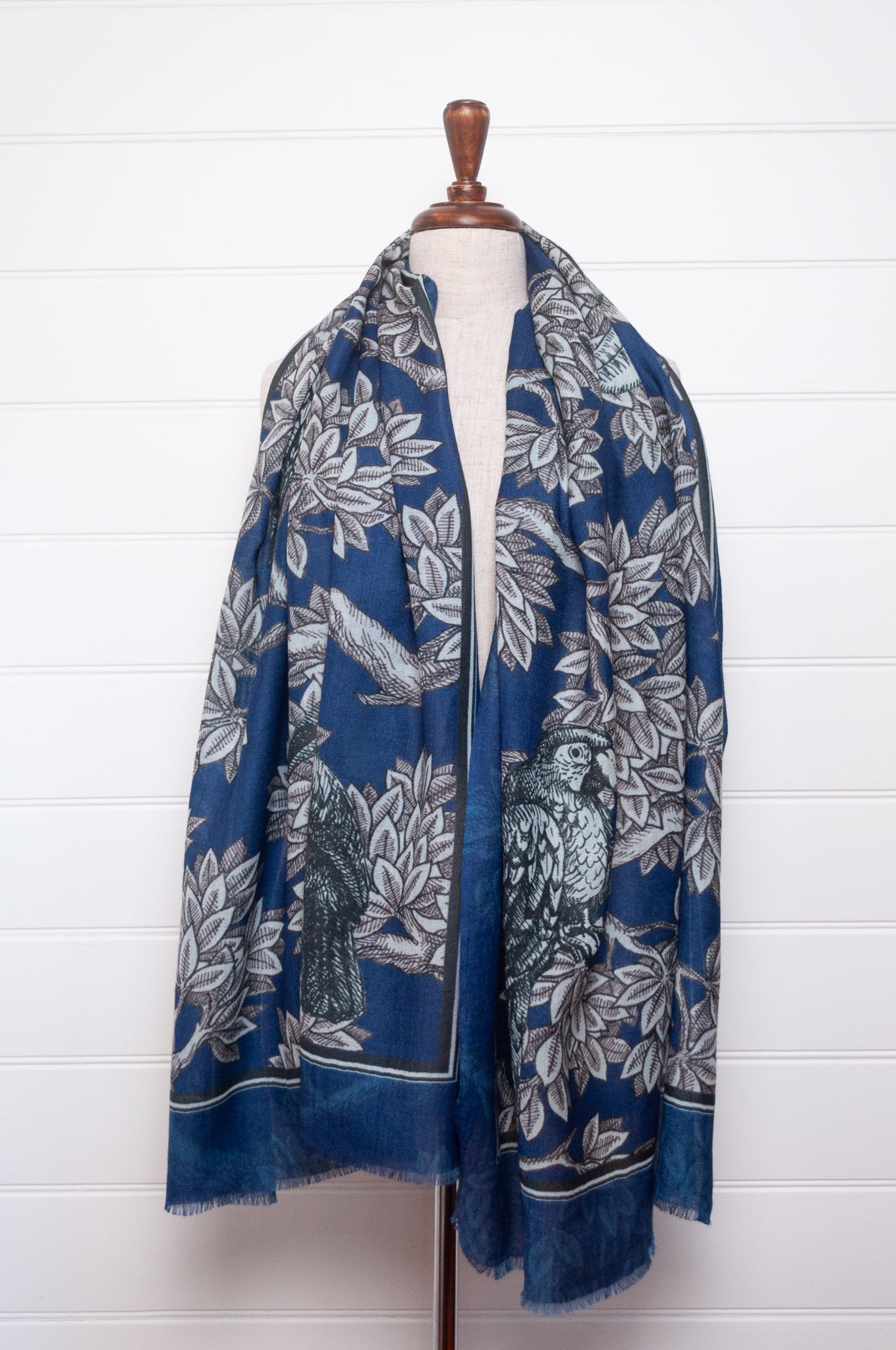 Blue floral patterned scarf on a white background