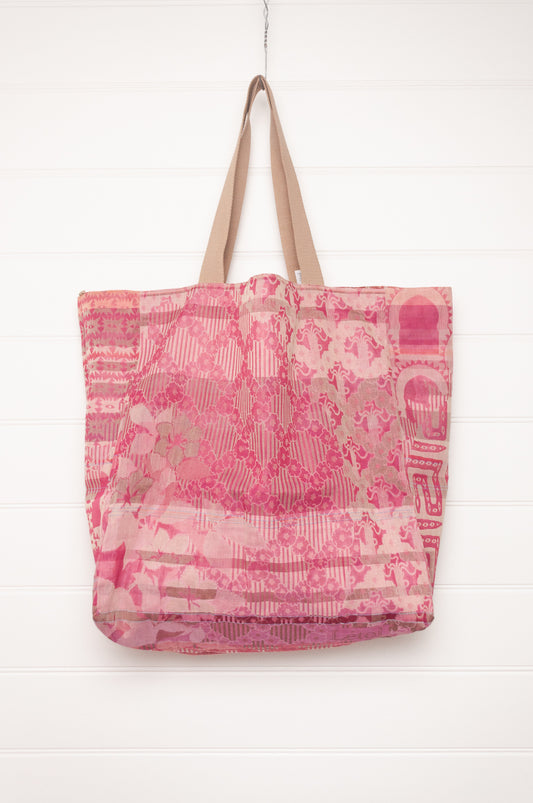 Letol organic cotton jacquard weave large tote bag in flowers and foliage in pinks and red.