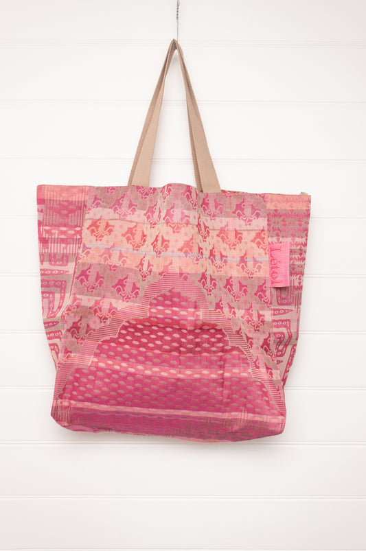Letol organic cotton jacquard weave large tote bag in flowers and foliage in pinks and red.
