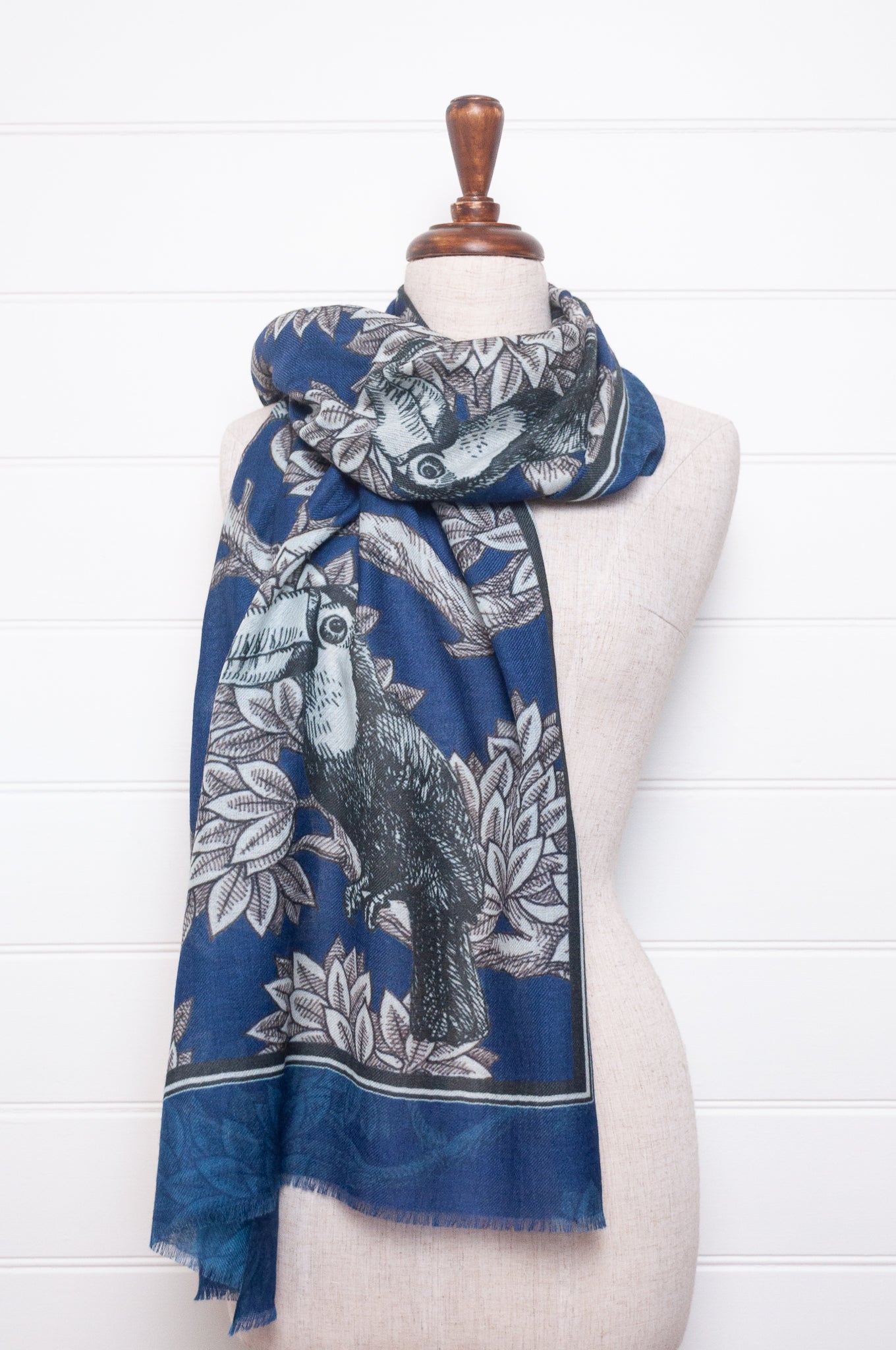 Blue floral patterned scarf on a white background