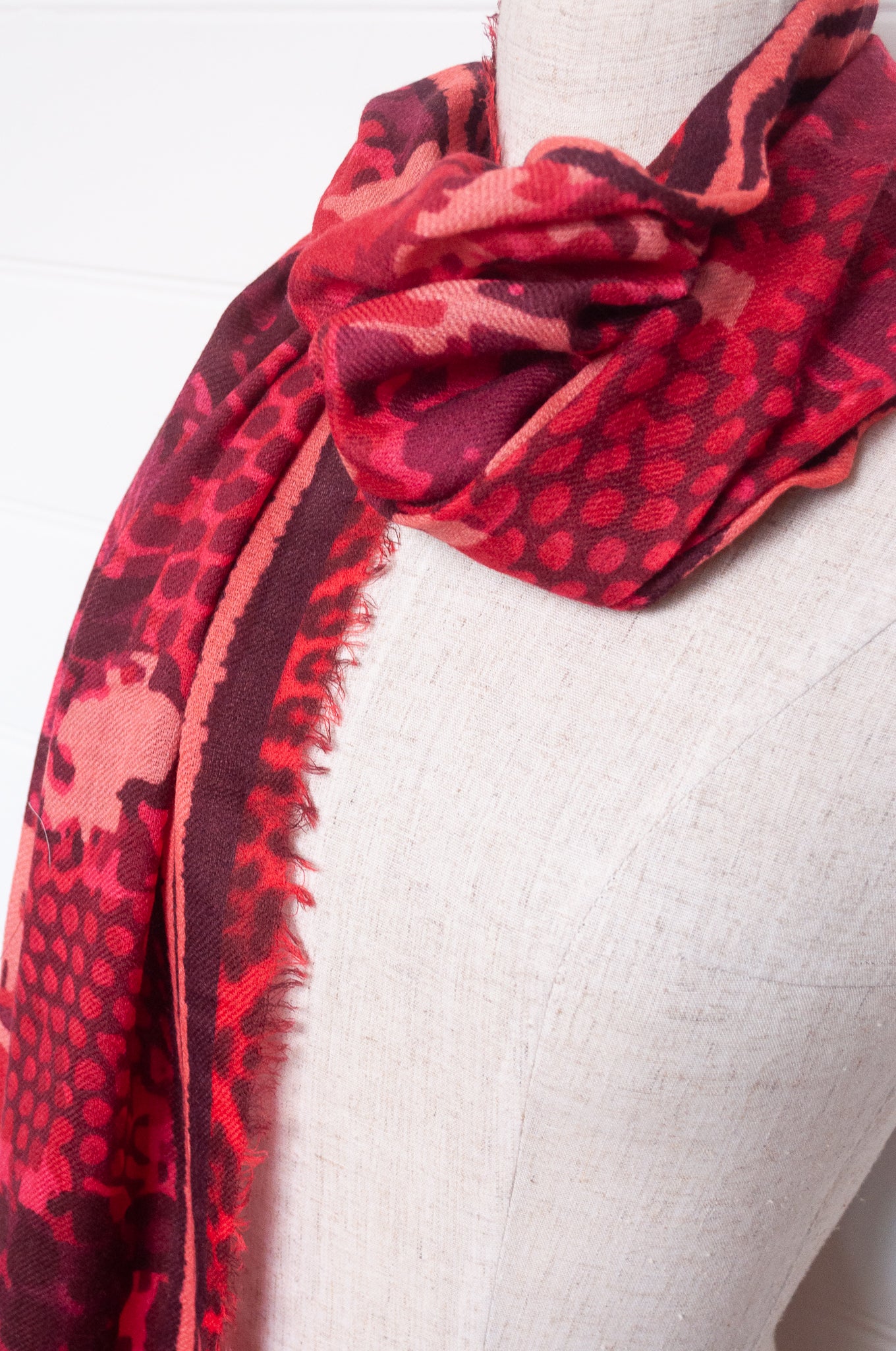 JH wool modal scarf pixeallated camouflage print in shades of red.