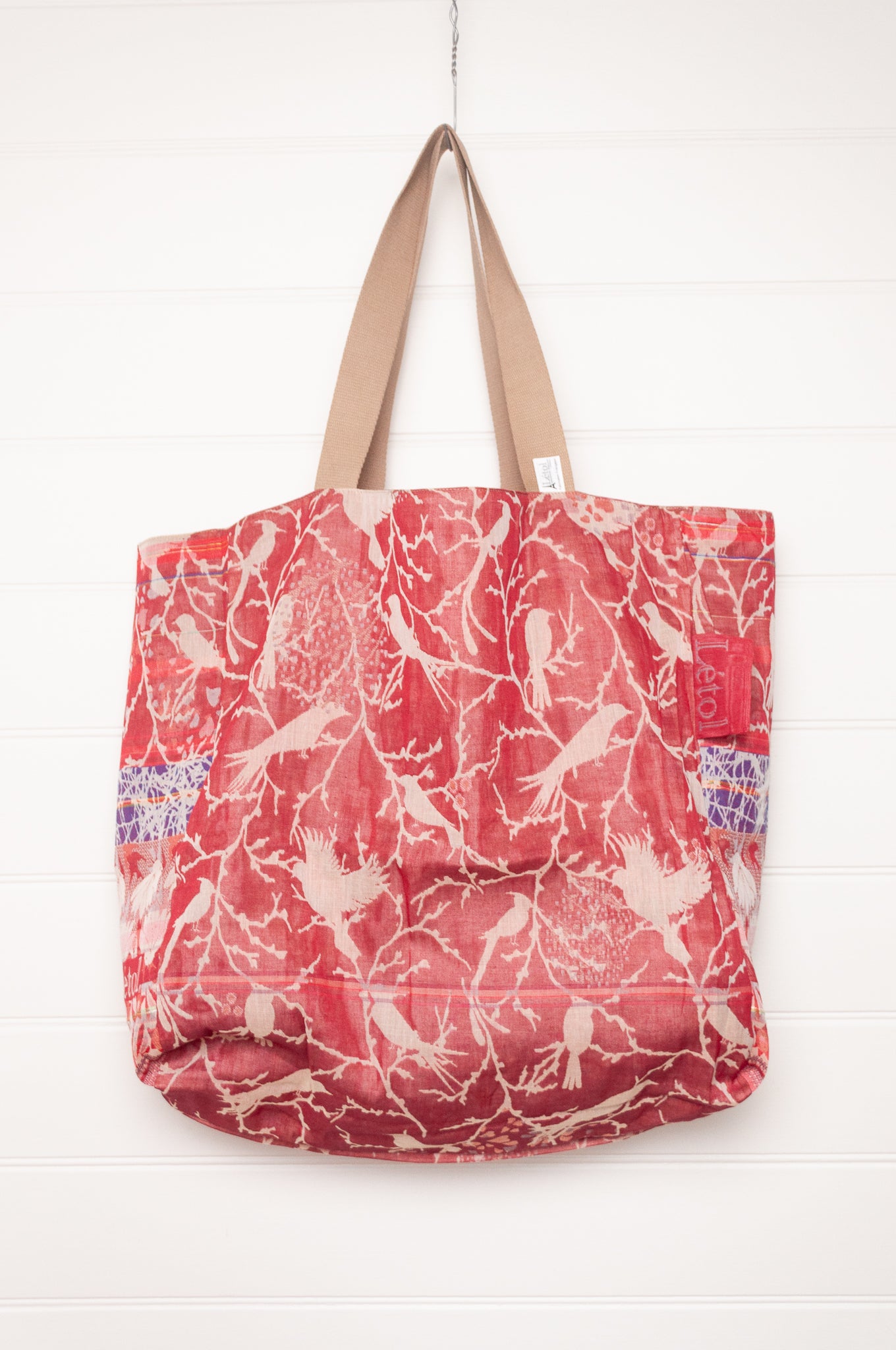 Letol organic cotton jacquard weave large tote bag in flowers and foliage in pinks and red.