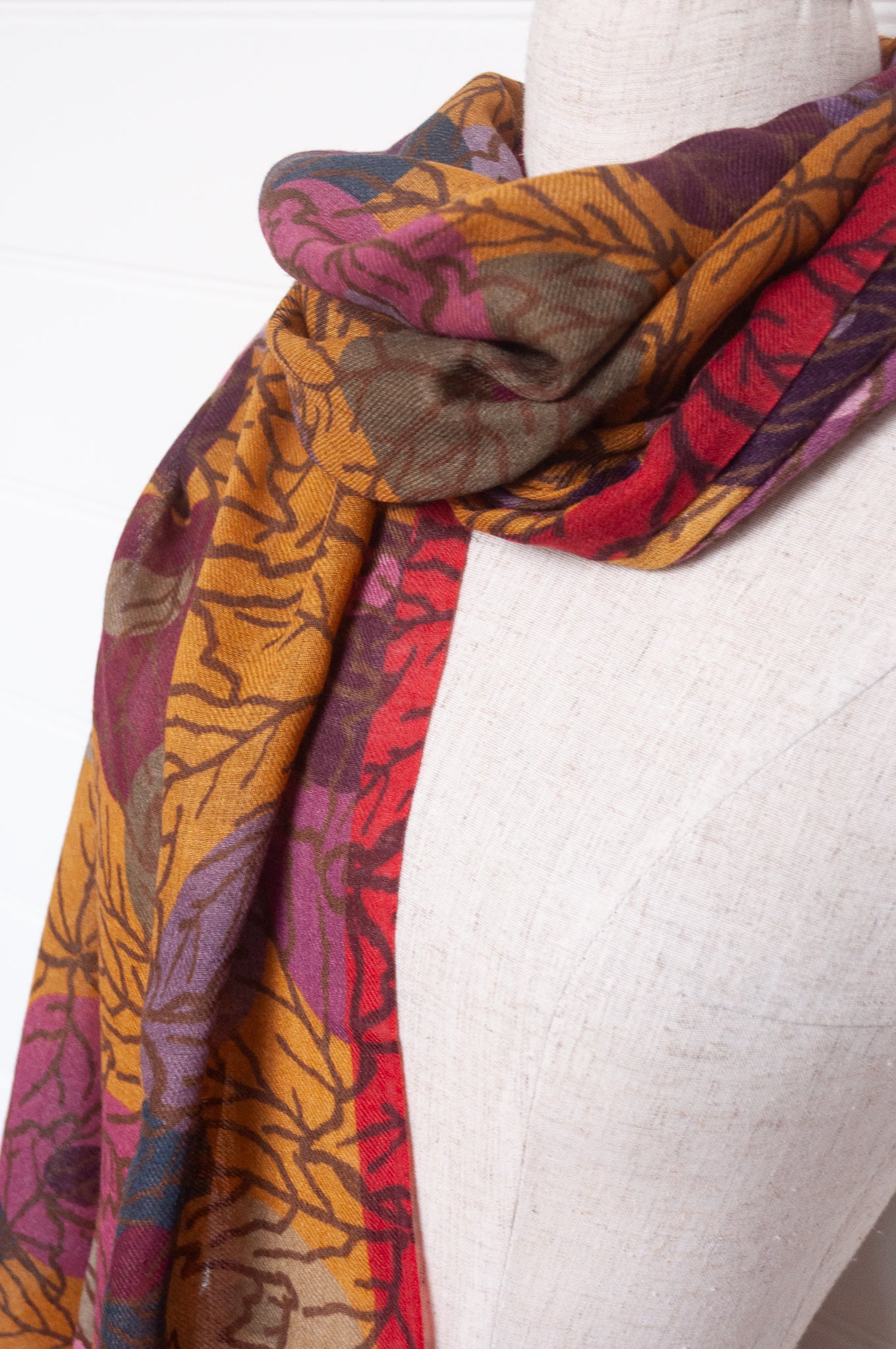Fine wool modal scarf in autumn tones featuring berry print.