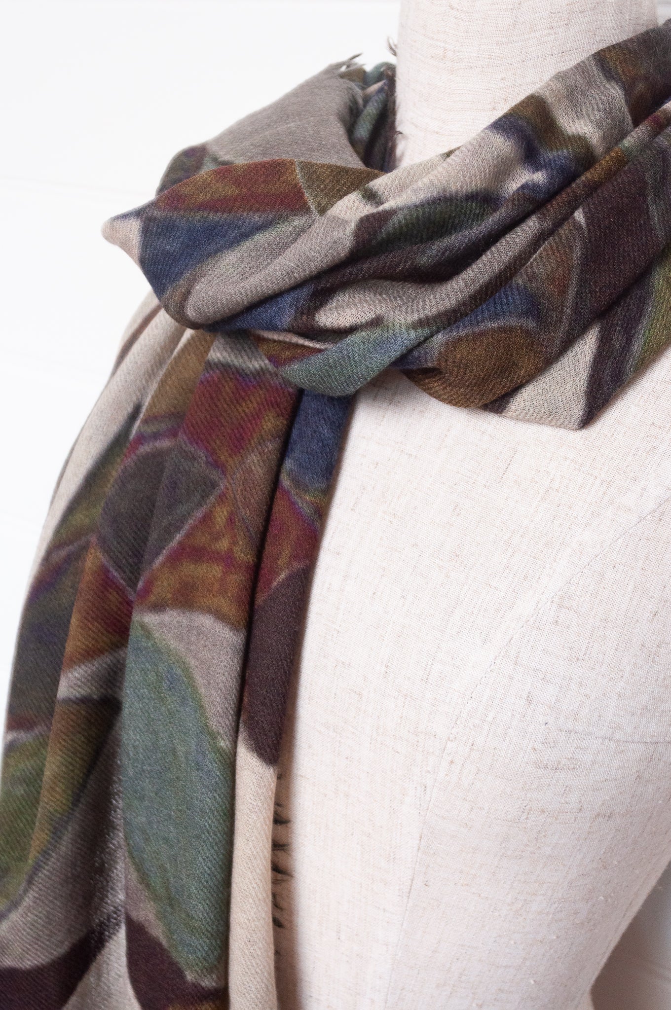 Fine wool modal scarf in blues and browns abstract print.