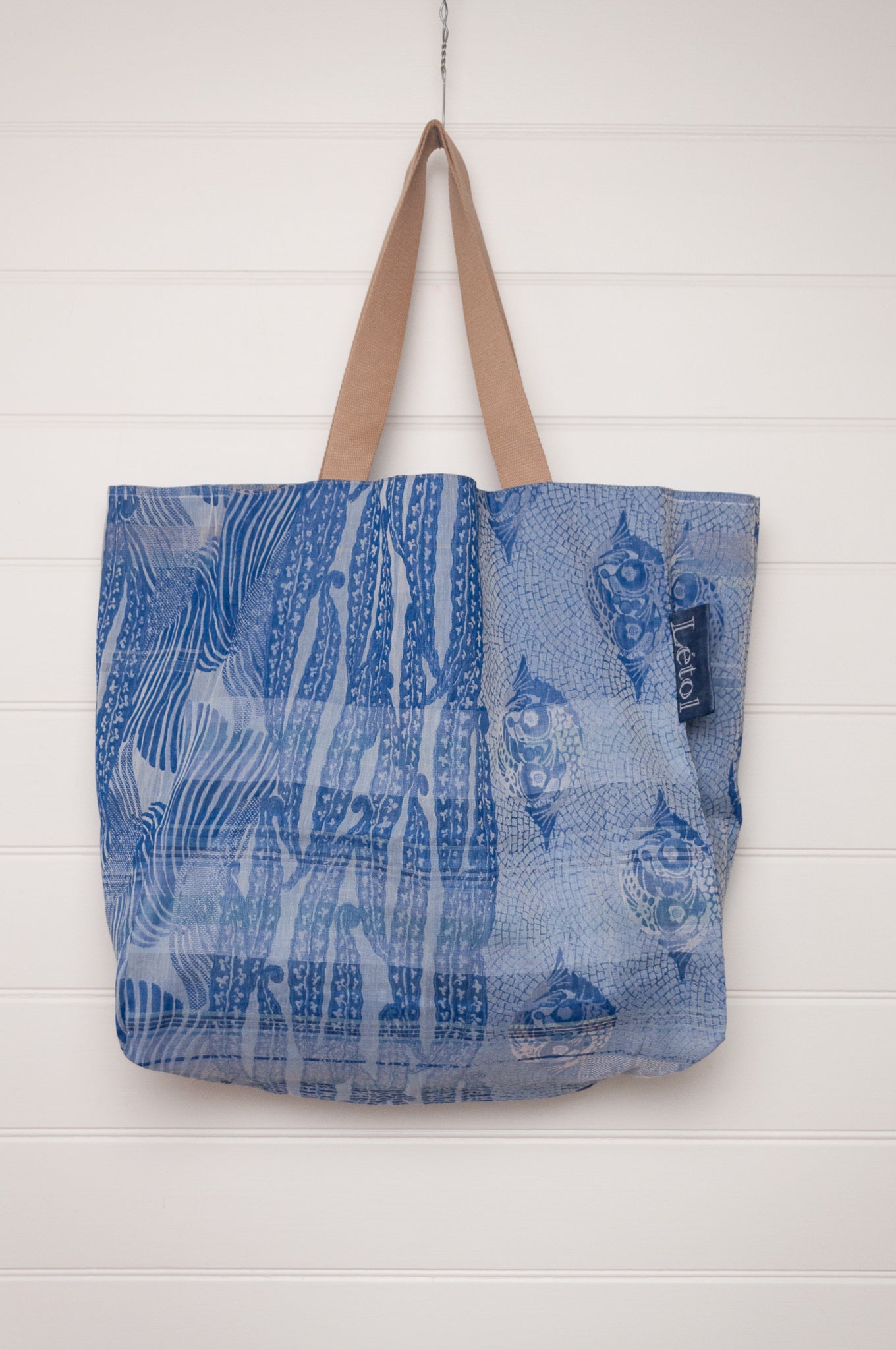 Letol organic cotton jacquard weave large tote bag in flowers and foliage in cobalt and sapphire blue.