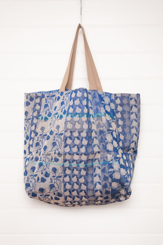 Letol organic cotton jacquard weave large tote bag in flowers and foliage in cobalt and sapphire blue.