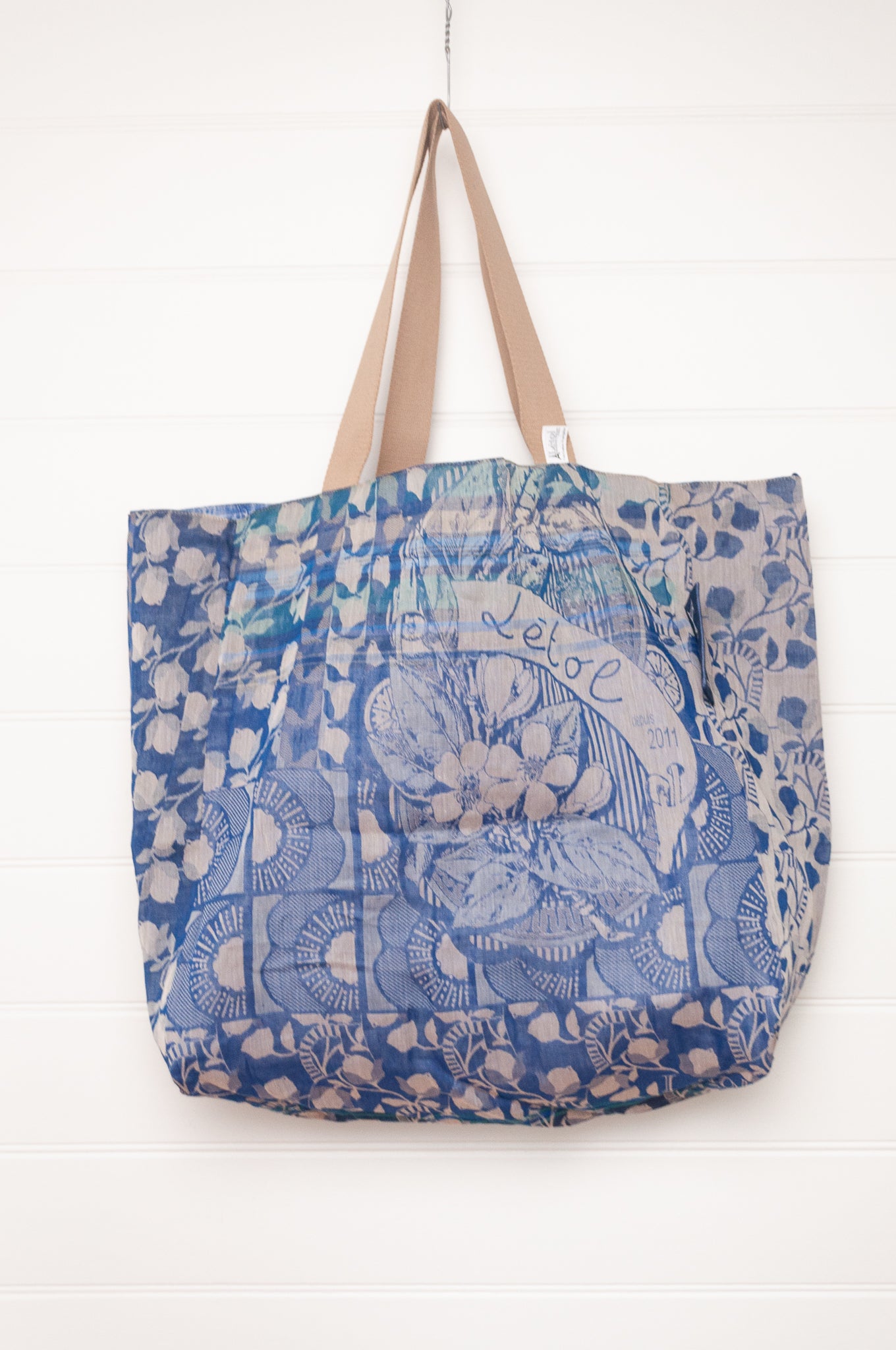 Letol organic cotton jacquard weave large tote bag in flowers and foliage in cobalt and sapphire blue.