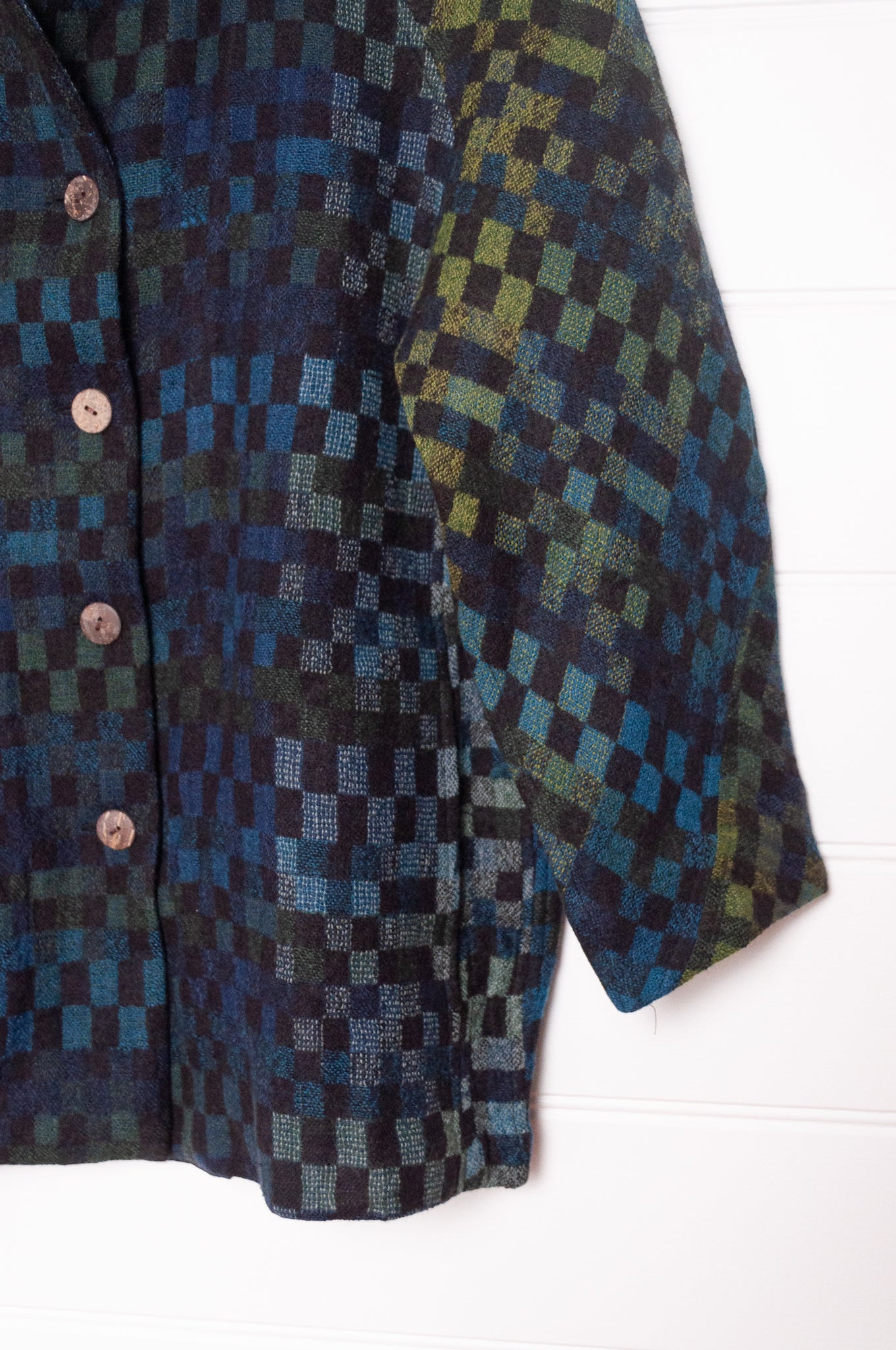 NK handwoven wool tailored button up jacket in deep blue and green checks. 