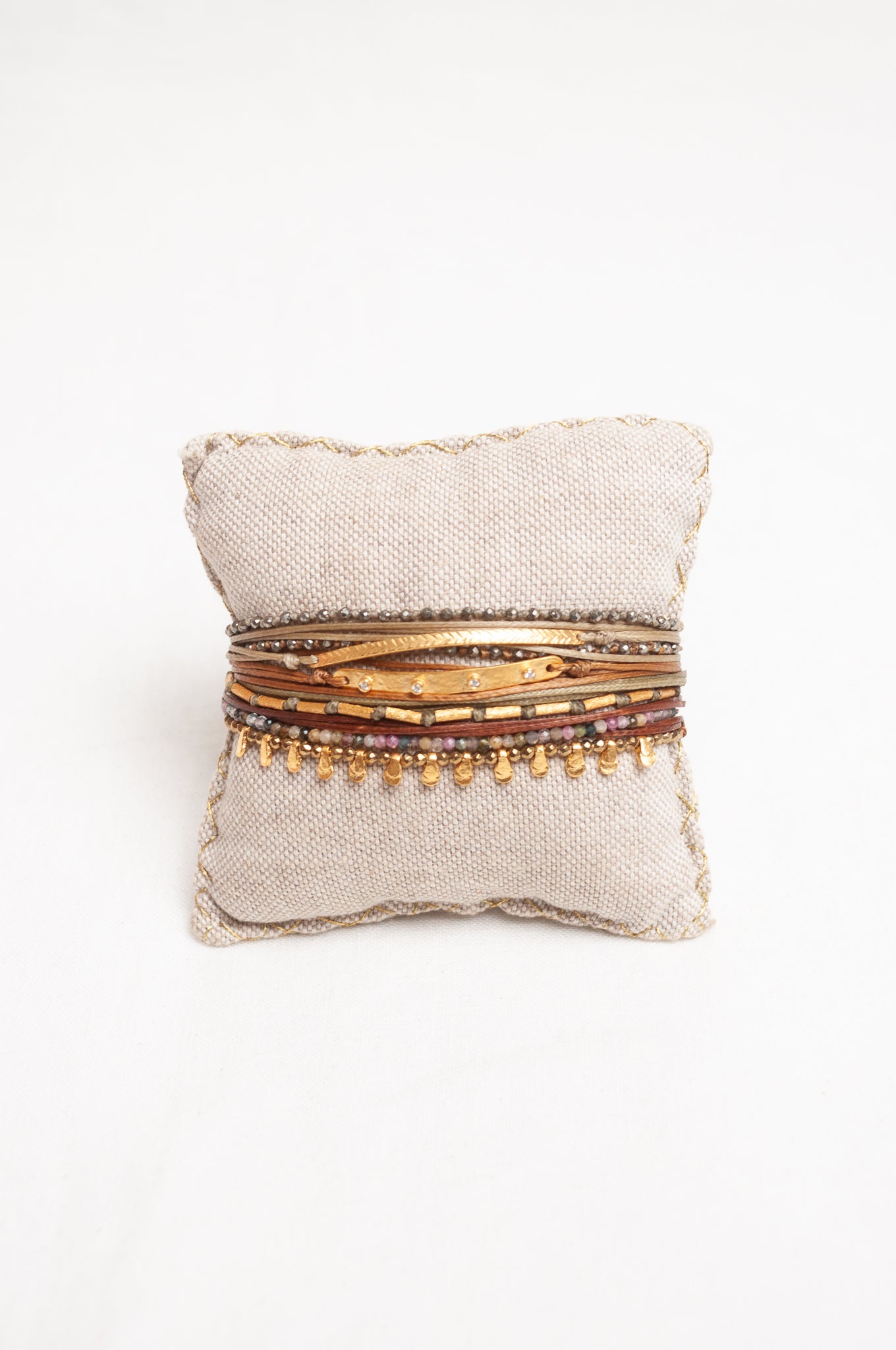 Mary Gaitani made in Greece waxed cord bracelet with gold charms and semi-precious stones.