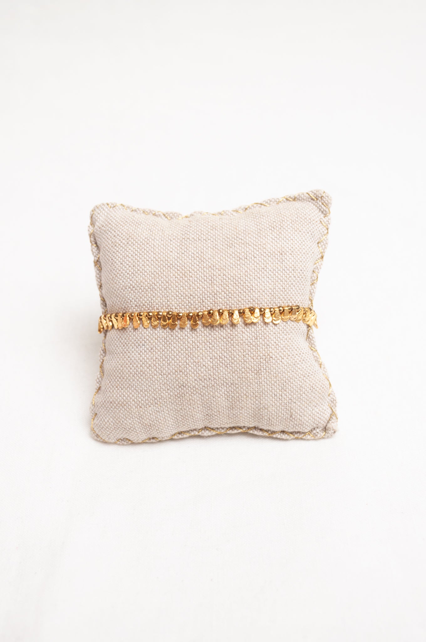 Mary Gaitani made in Greece waxed cord bracelet with gold charms and tiny tassel.