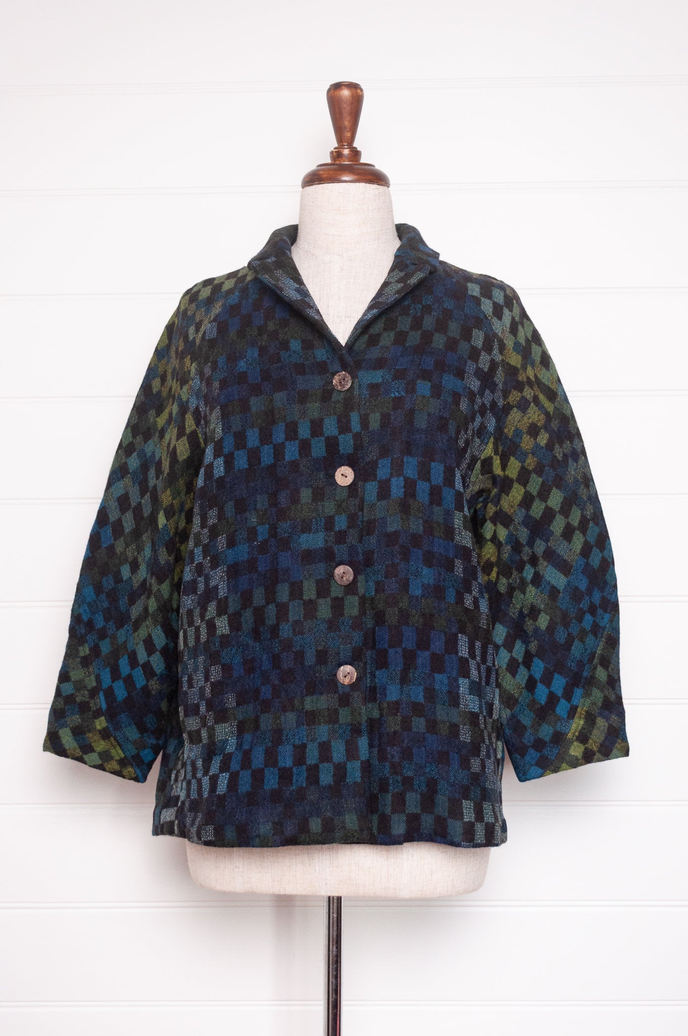 NK handwoven wool tailored button up jacket in deep blue and green checks. 
