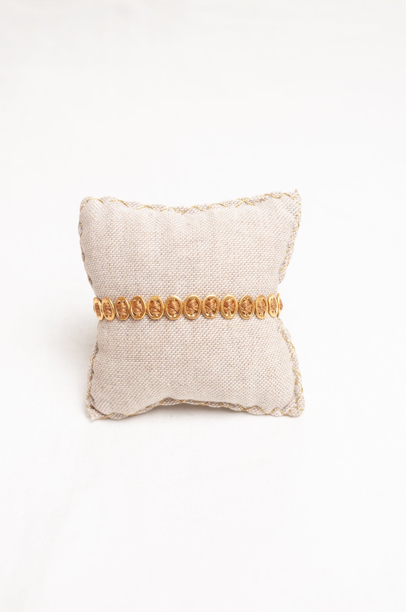 Mary Gaitani made in Greece plaited waxed cord bracelet with gold buckle charms.