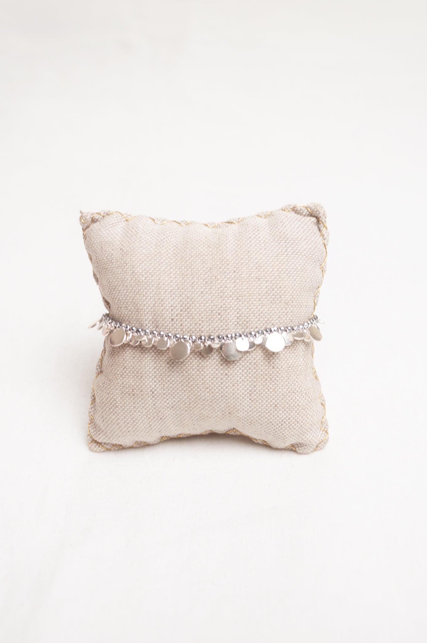 Mary Gaitani made in Greece waxed cord bracelet with silver charms and semi-precious stones.