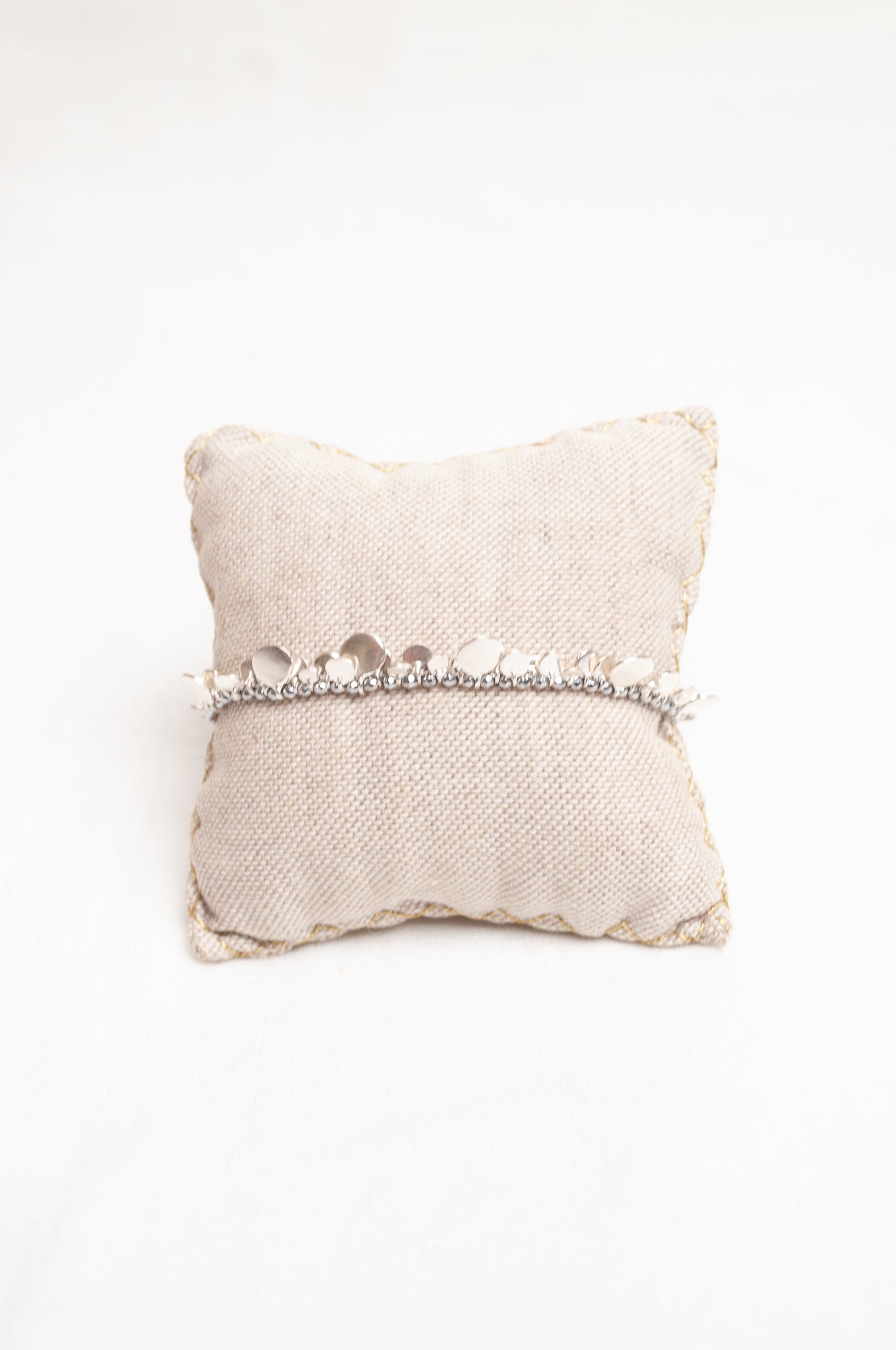 Mary Gaitani made in Greece waxed cord bracelet with silver charms and semi-precious stones.