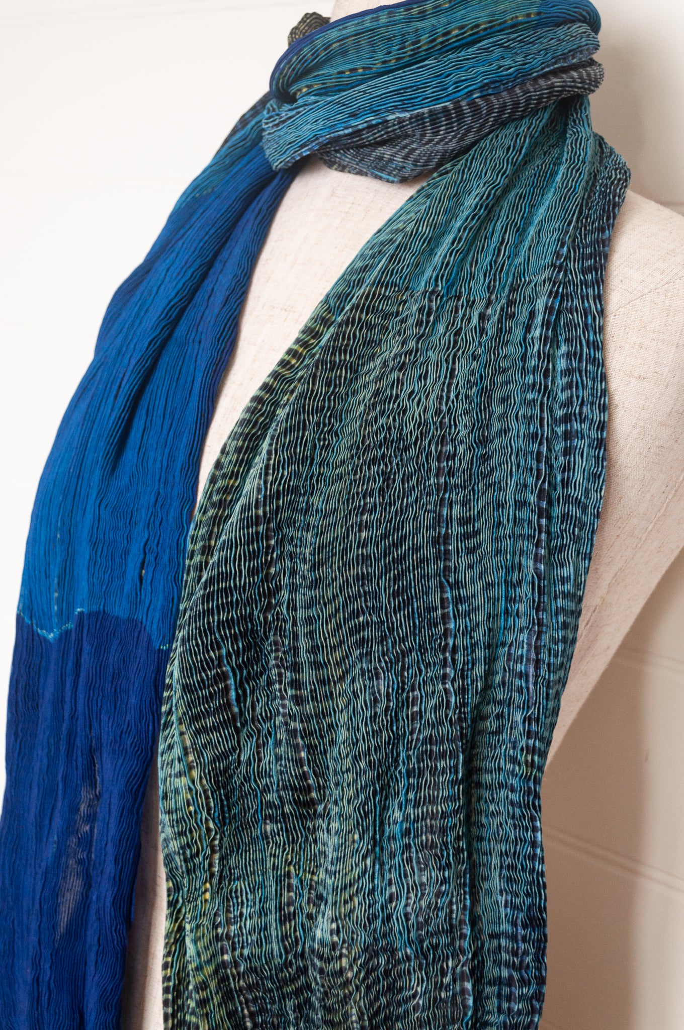 Neeru Kumar crinkle silk shibori scarf in cobalt blue and turquoise with a speckled print.