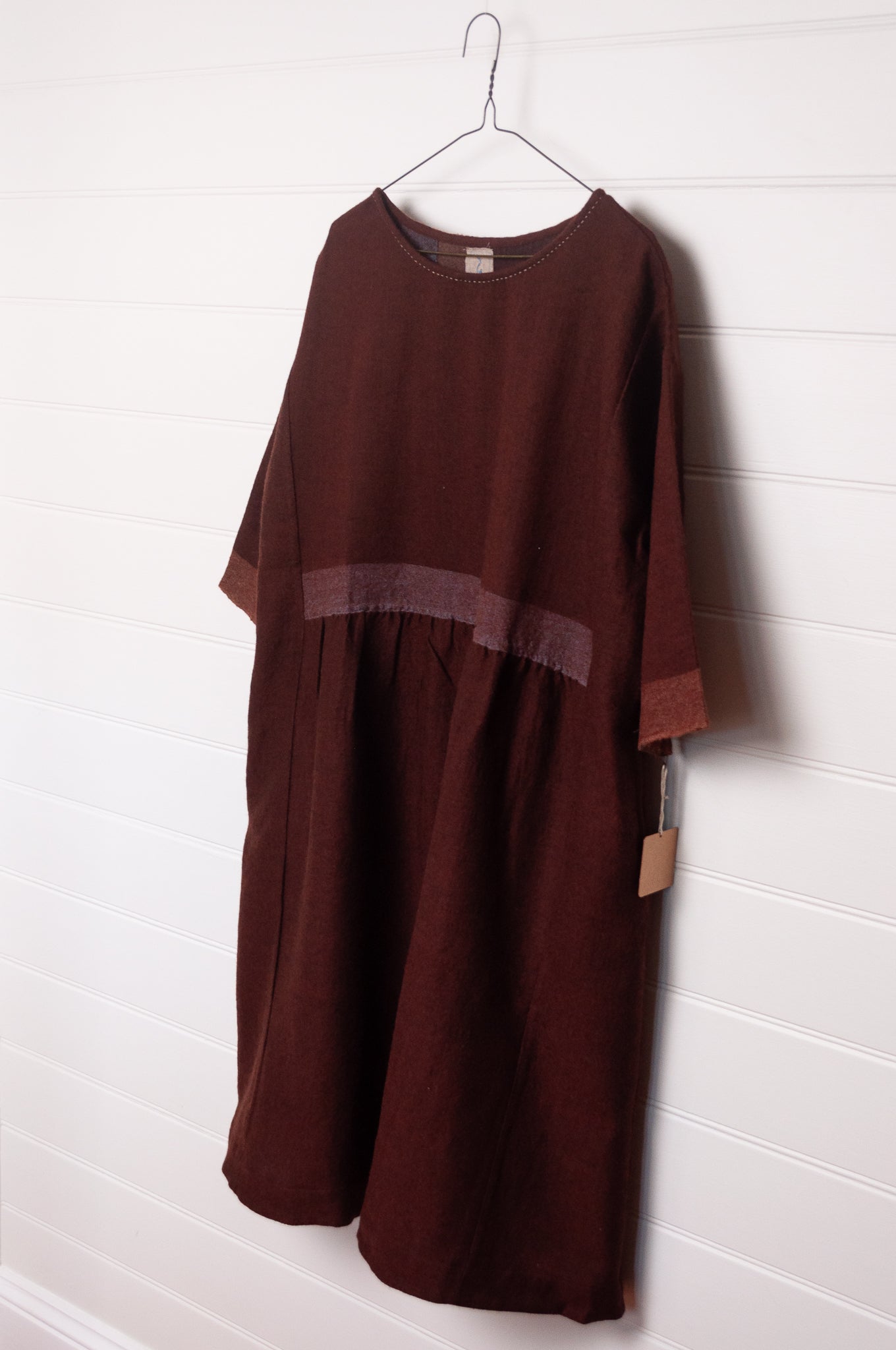 DVE wool Padma loose fitting three quarter sleeve dress in pinecone russet brown.