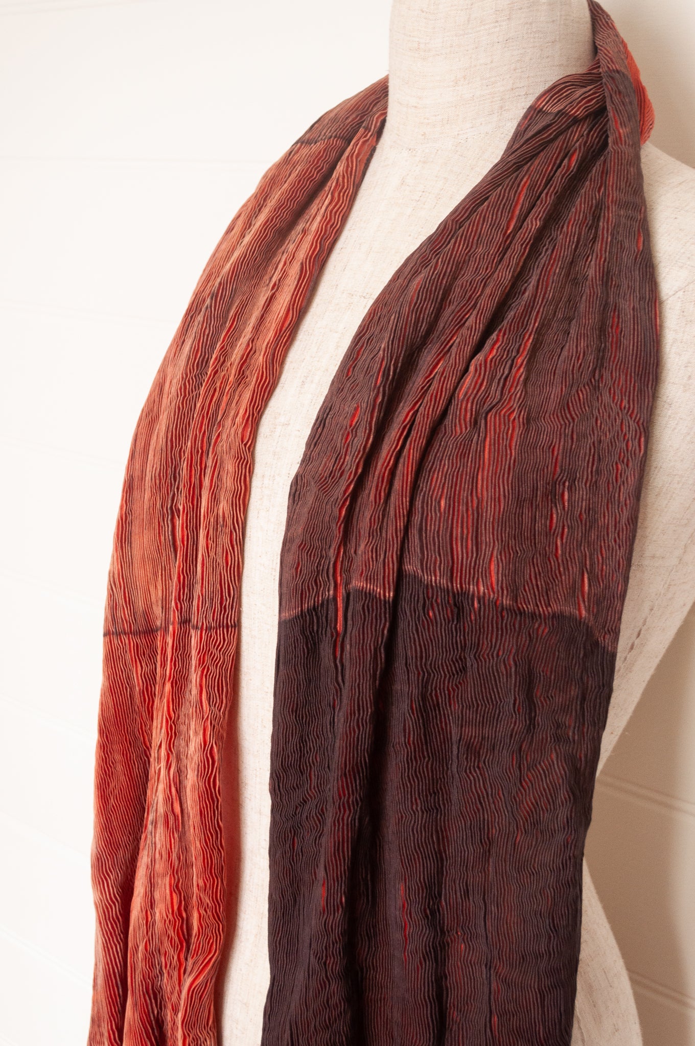 Neeru Kumar crinkle silk shibori scarf in pomegranate shades of red.