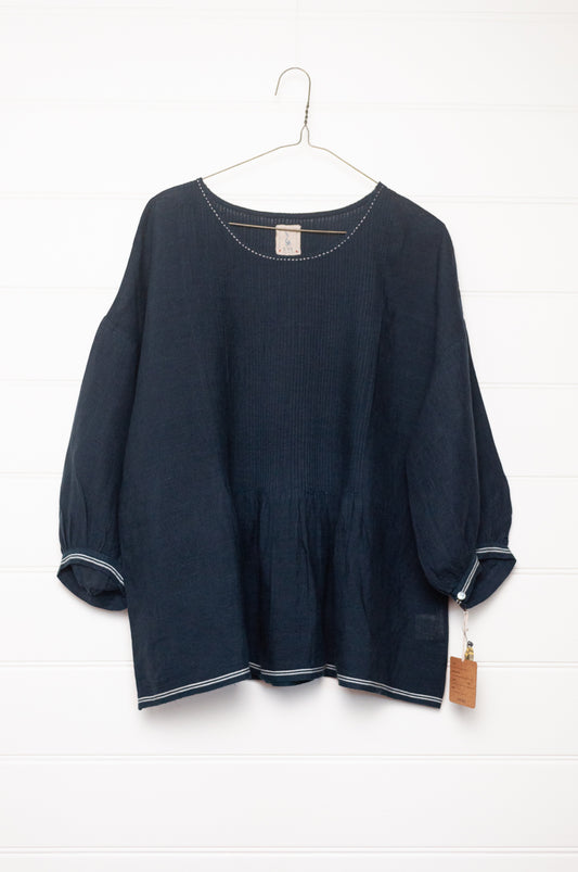DVE Anisha pintucked top in navy linen with white striped selvedege details.