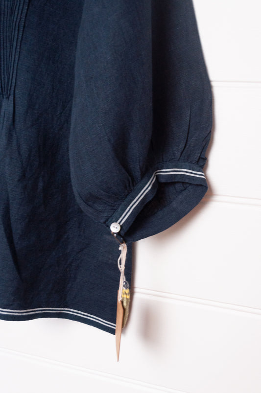 DVE Anisha pintucked top in navy linen with white striped selvedege details.